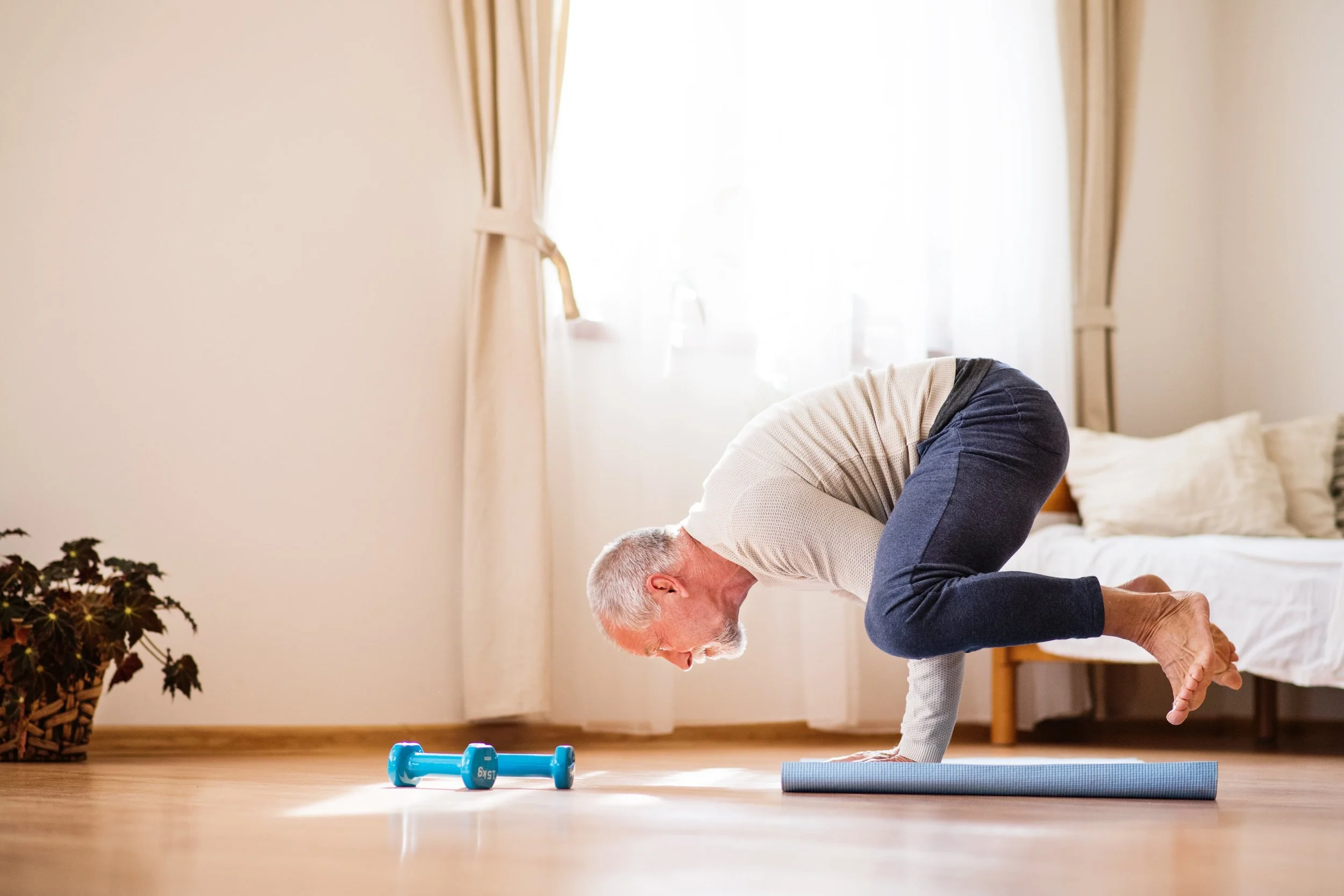 senior-man-doing-exercise-at-home-PZSVA95.jpg