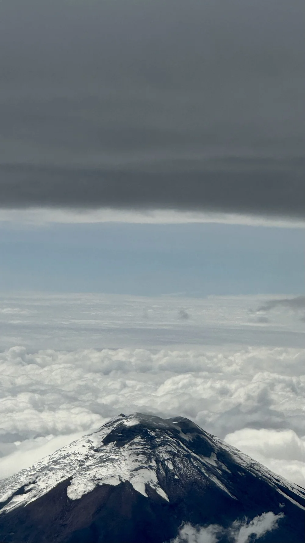 View of snow capped volcano from the plane between Quito and Cuenca