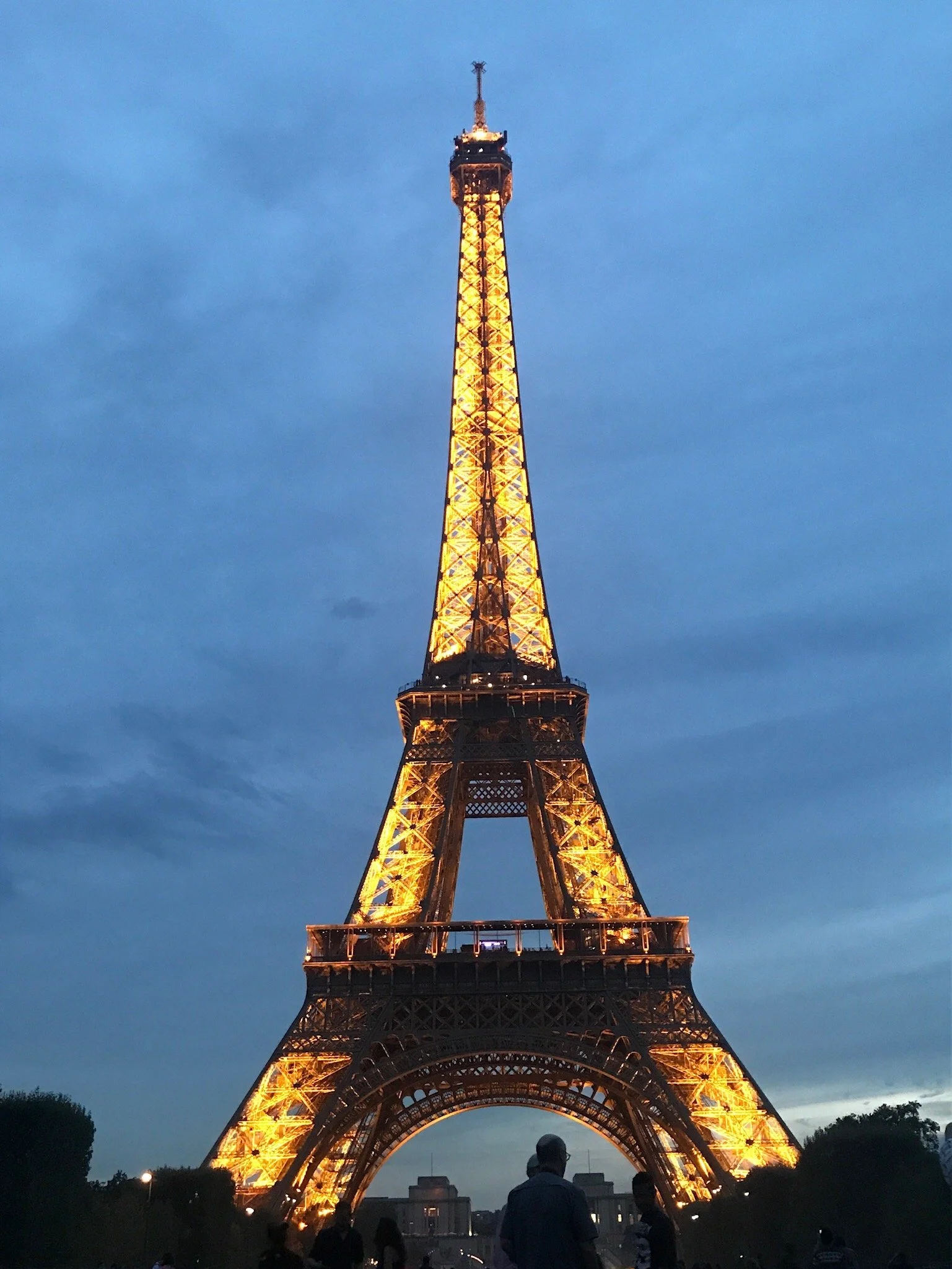 View of the Eiffel Tower in Paris, France lit up at night