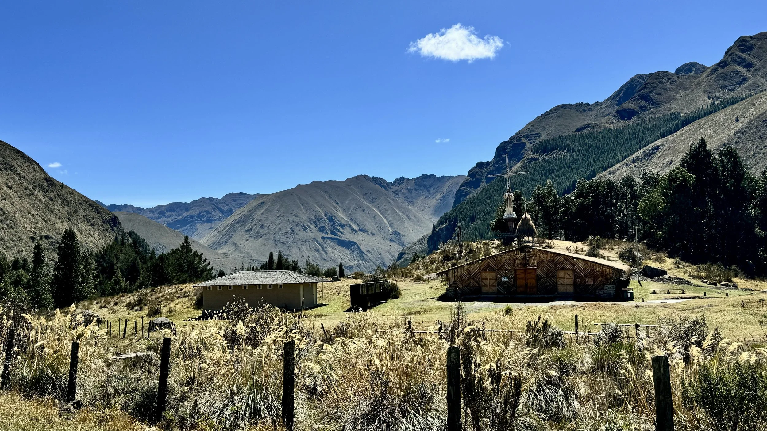 The Santuario de la Vírgen del Cajas buildings set against the Andean mountains of Cajas National Park, Ecuador