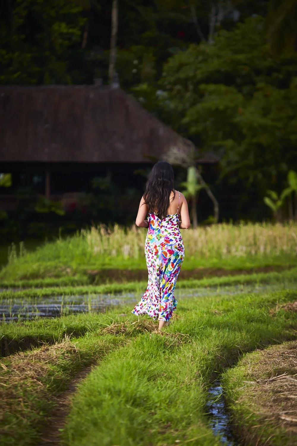Karen Gomez walking through the rice terraces at Bali Ecostay