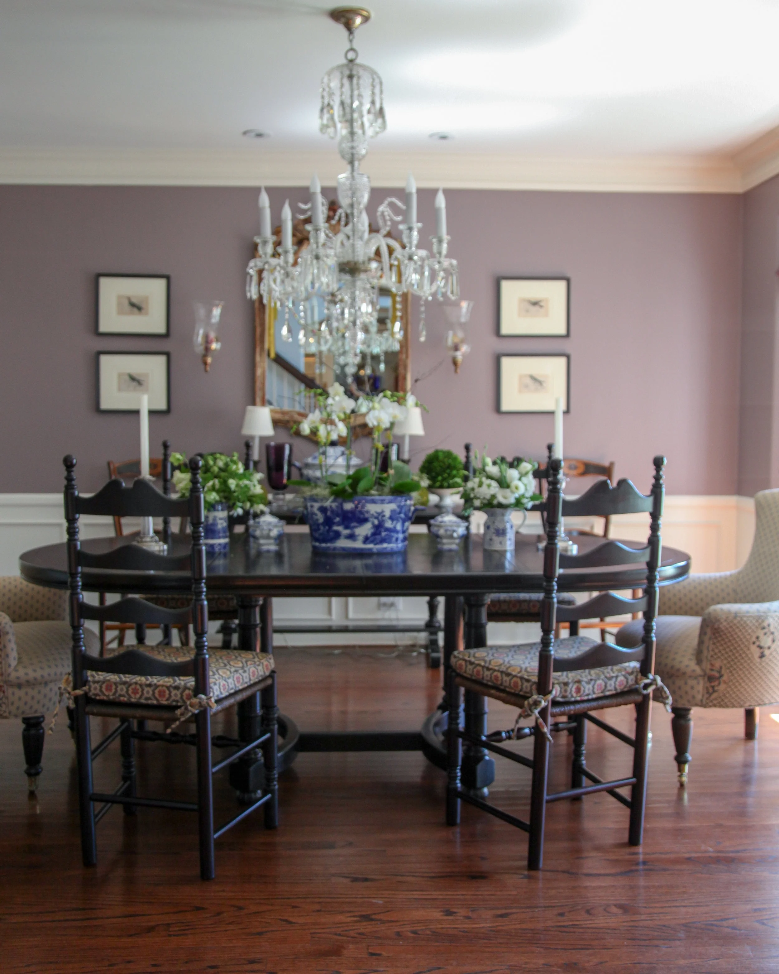 These walls are painted Benjamin Moore’s Wet Concrete . Blues and natural wood tones marry well with this dark mauve color.
