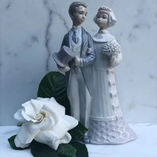 Keeping it in the family - a third generation will use this Llardro wedding cake topper.