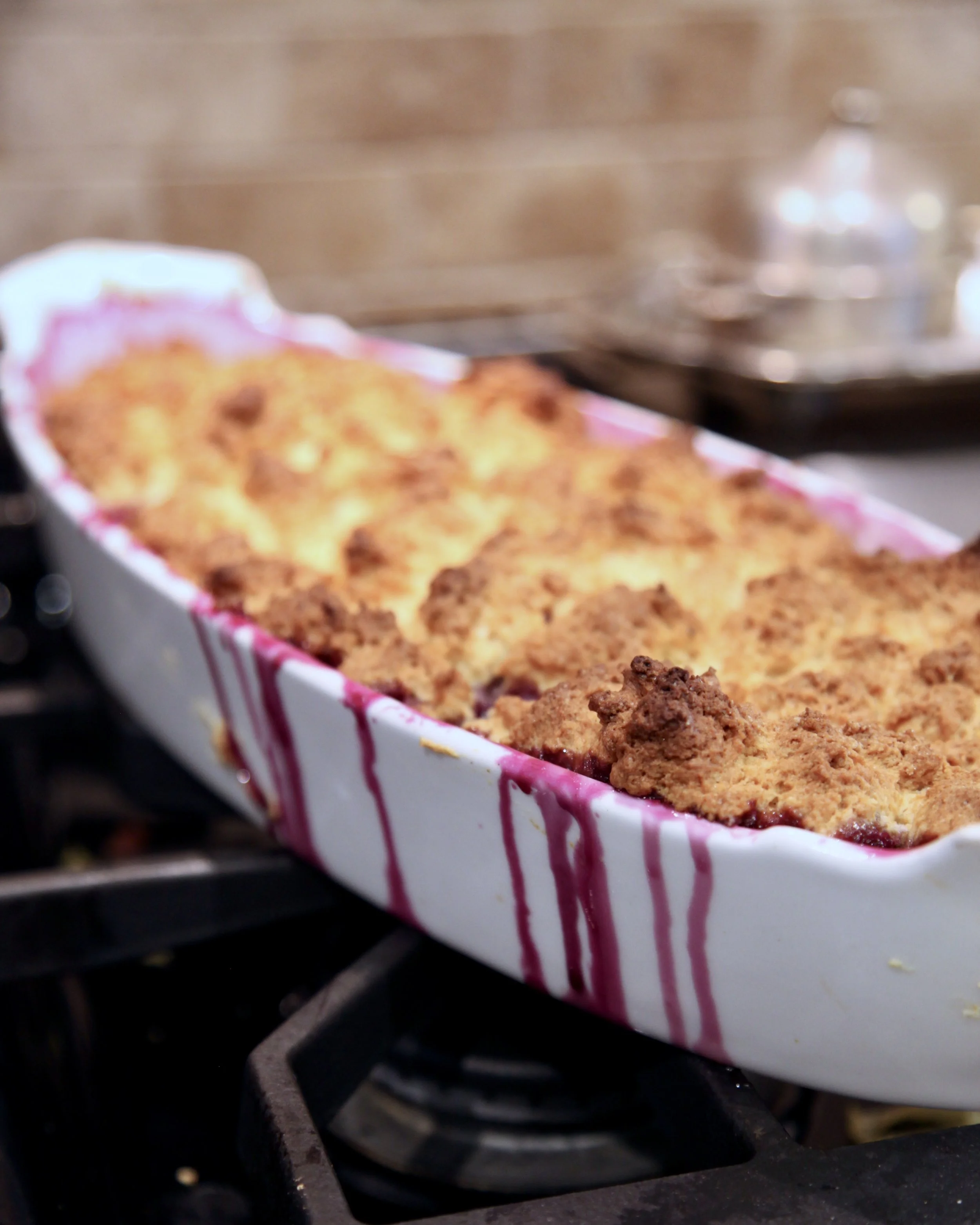 The cobbler is baked in a 19th century French baking dish. Warning: oozing might occur.
