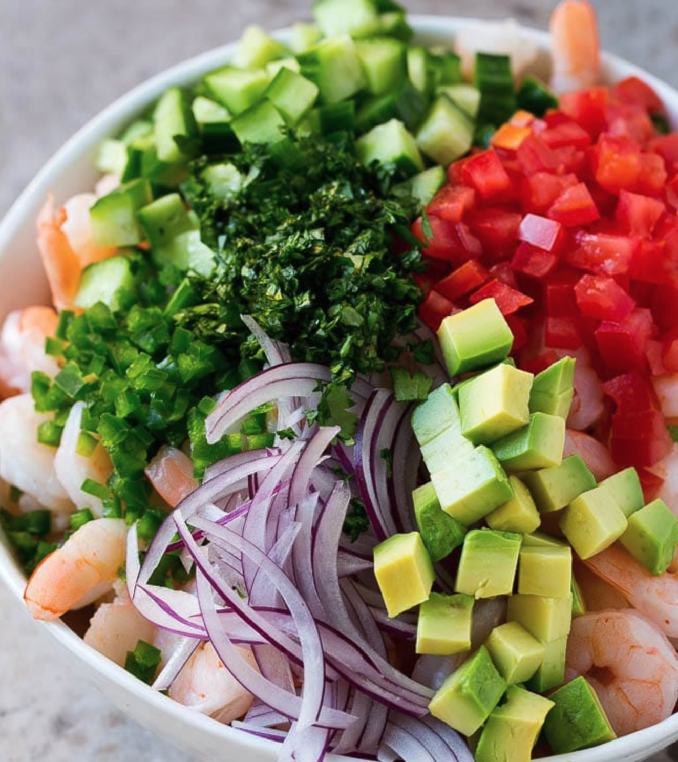 Shrimp Ceviche is loaded with fresh ingredients and then marinated in lime, lemon and orange juice.
