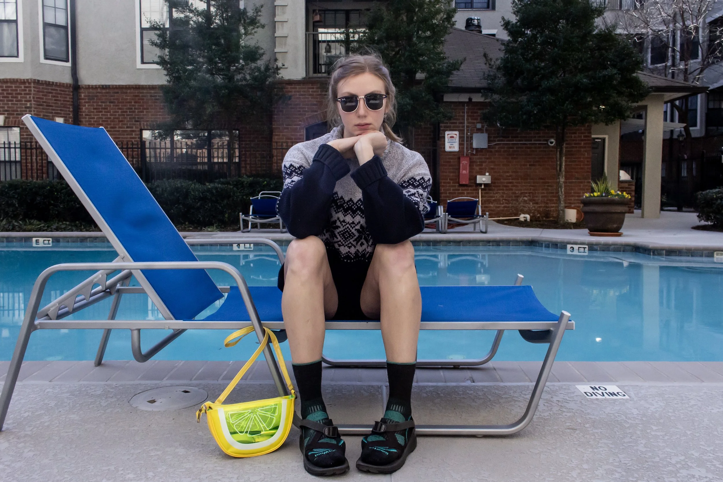 Sweater: vintage, bike shorts: Under Armour, socks: Smart Wool, sandals: Chacos, sunnies: Ray Ban, bag: Cracker Barrel