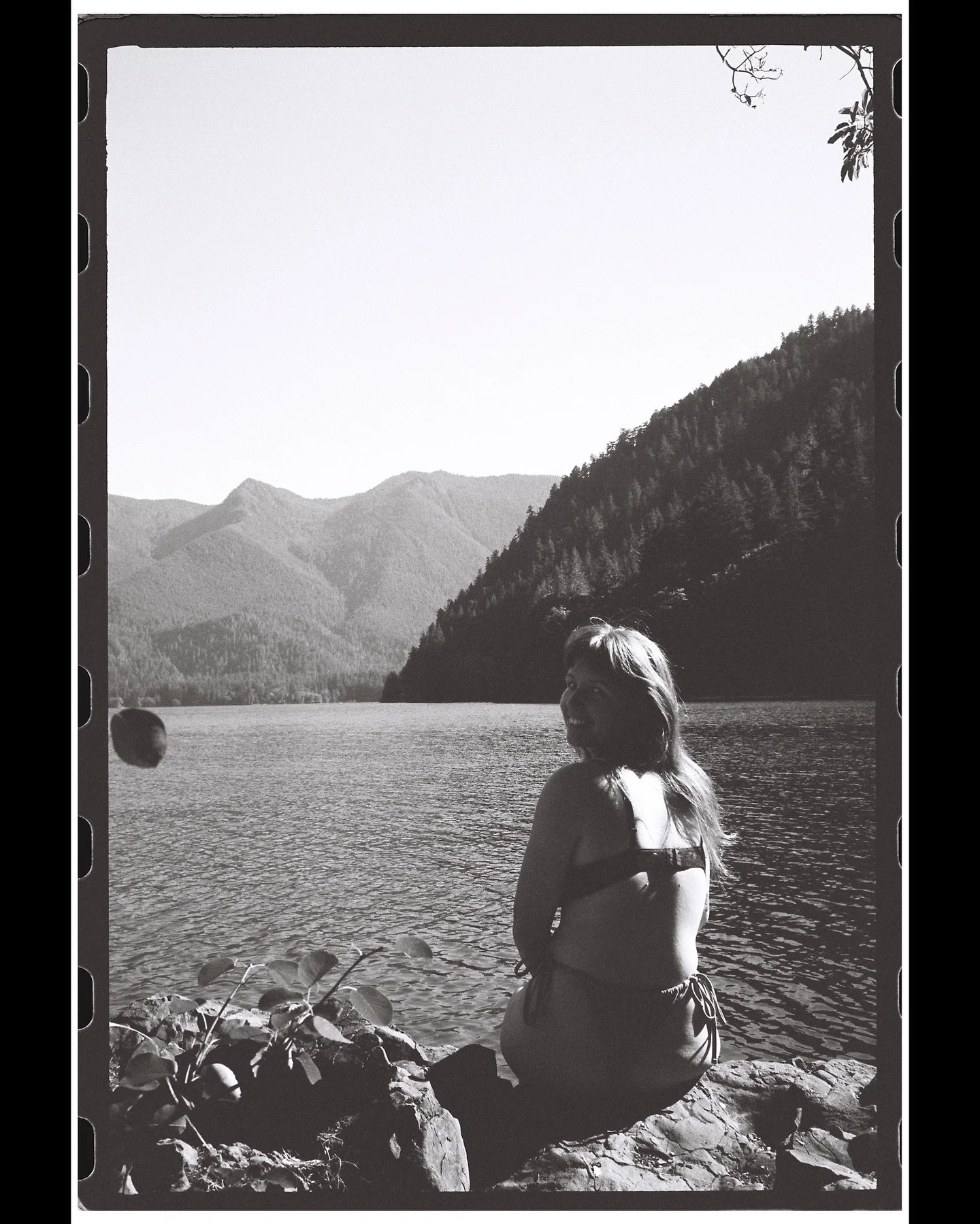 lizz in the last rays of sunlight at lake crescent in july 🖤