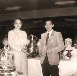 Coleman Shannon with a local dealer, Mrs. McAtee