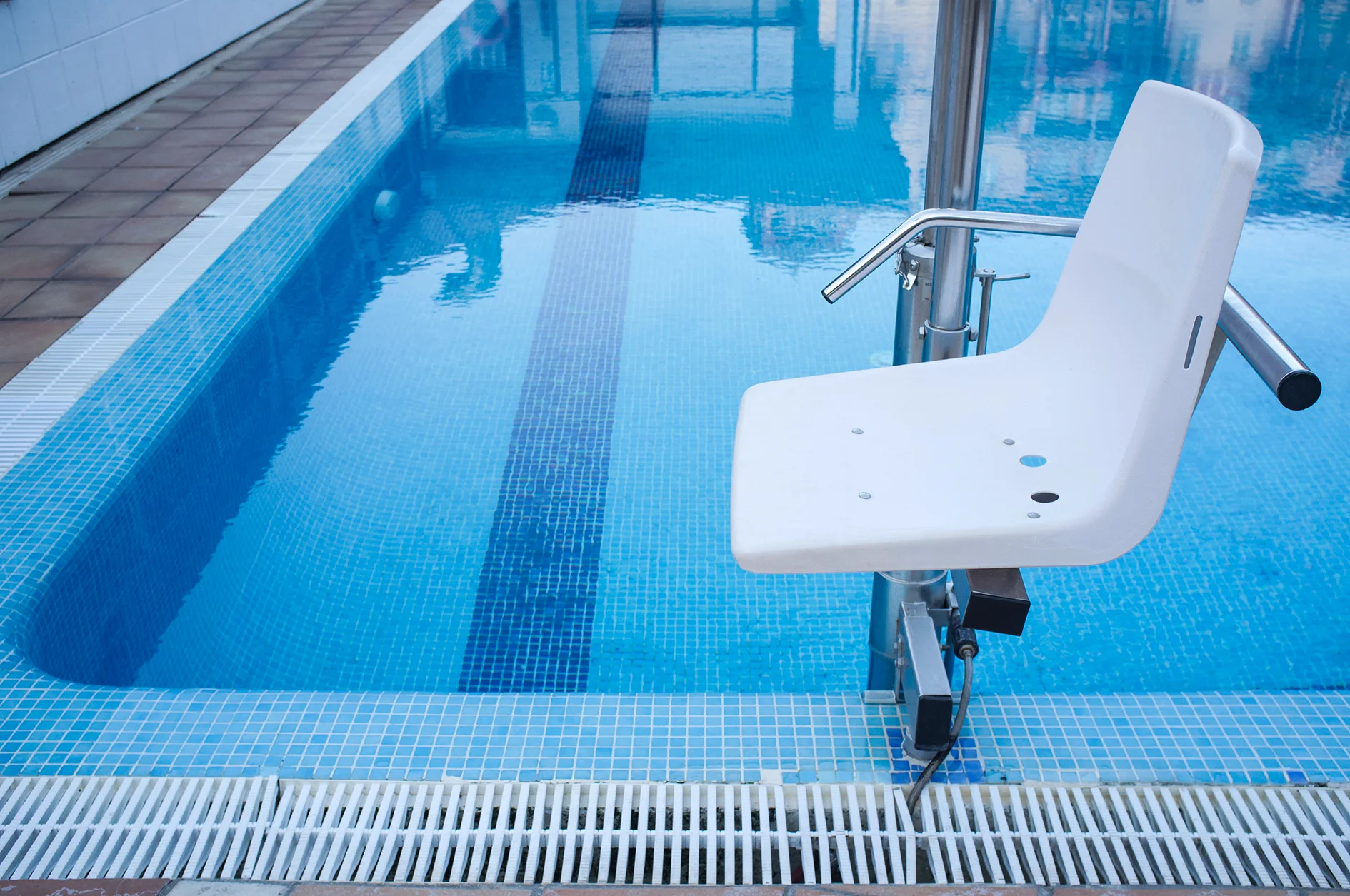 stock-photo-swimming-pool-lift-for-disabled-people-access-to-the-pool-holidays-resort-background-792700756.jpg