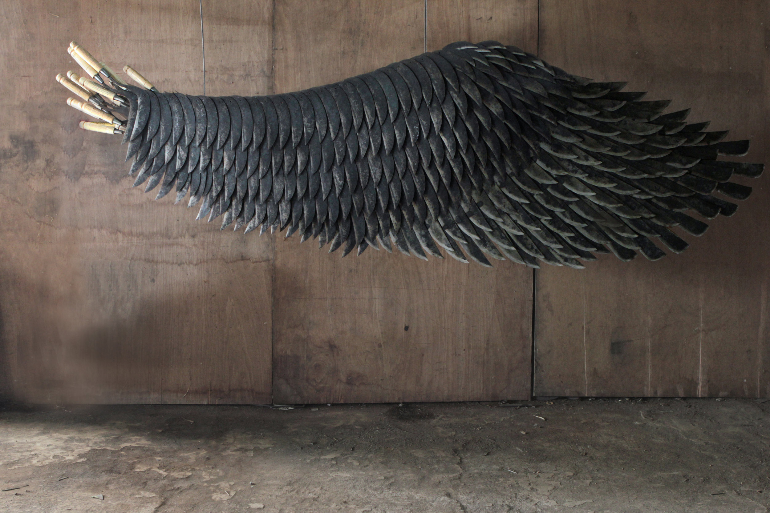 Isabel and Alfredo Aquilizan, ‘Left Wing Project (Belok Kiri Jalan Terus) Wing B’, 2017-2018, sickles, weighing scale, rice sack, 302 x 85 x 42cm. Image courtesy of Yavuz Gallery and the artists.