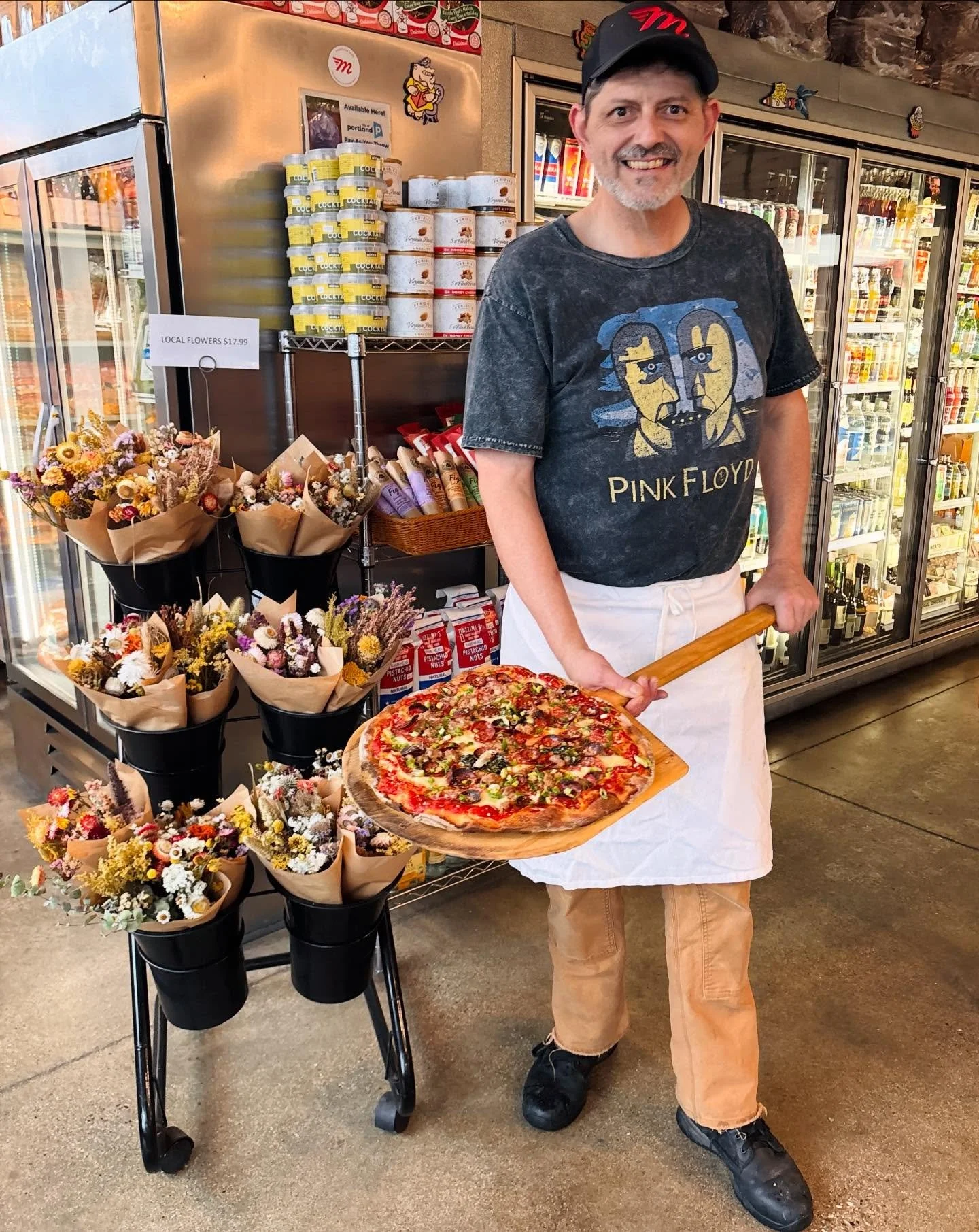 We have the perfect thing for this blustery Winter day&hellip; you guessed it&hellip; Happy Pizza Friday friends! 💚🤍❤️

Team-member Jeremy holds our beautiful CHEESE PIE with the add-ons TRE CARNI (Soppressata, Pepperoni, and our House-made Fennel 