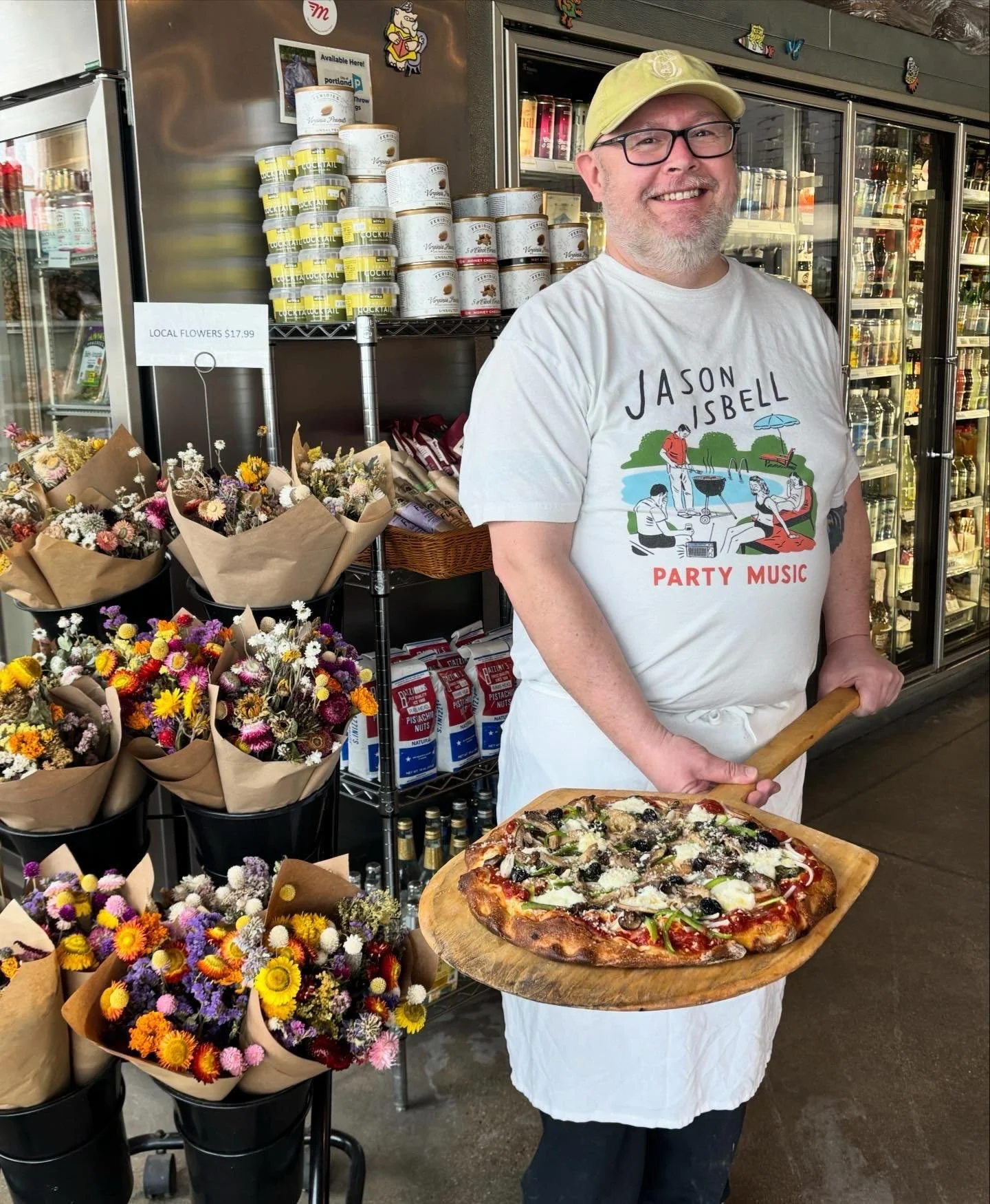 Happy Pizza Friday to all! 💚🤍❤️

Team-member David is holding the beautiful MARGHERITA ROMANA pie with it&rsquo;s beautiful creamy burrata and basil. This pie also has the SUPREME add-on &ndash; cured black olives, fresh green pepper, onion &amp; m