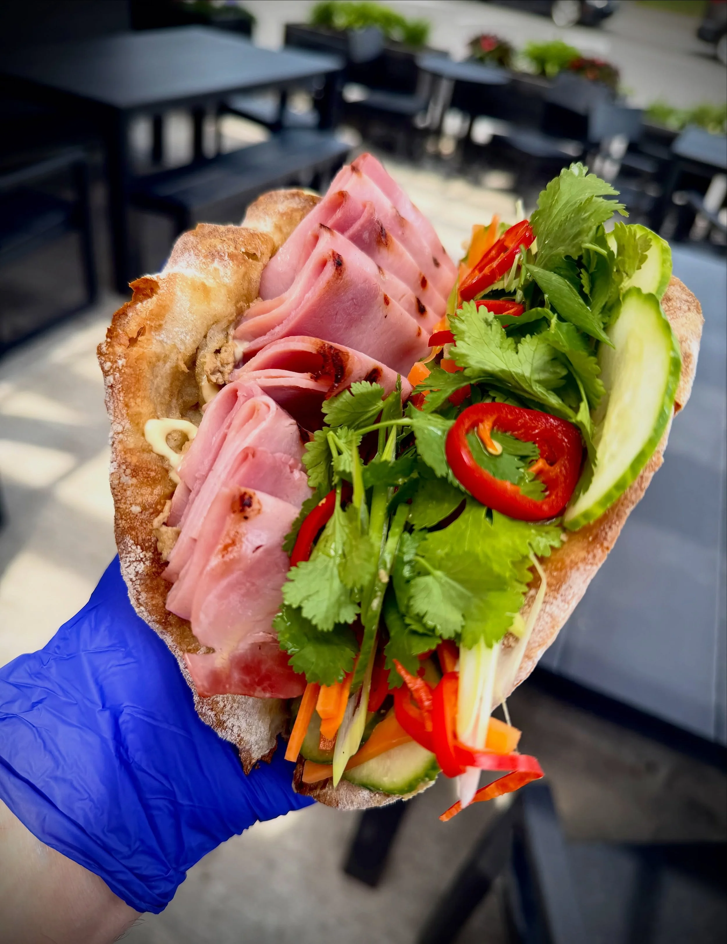 SANDWICH SPECIAL
Our super tasty BAHN MI SANDWICH with pork/duck pate, grilled ham, aioli, pickled carrot, pickled Fresno, cucumber and cilantro on our bakery&rsquo;s mezze luna bread &mdash; fresh &amp; delicious, perfect for warm weather eating!  1