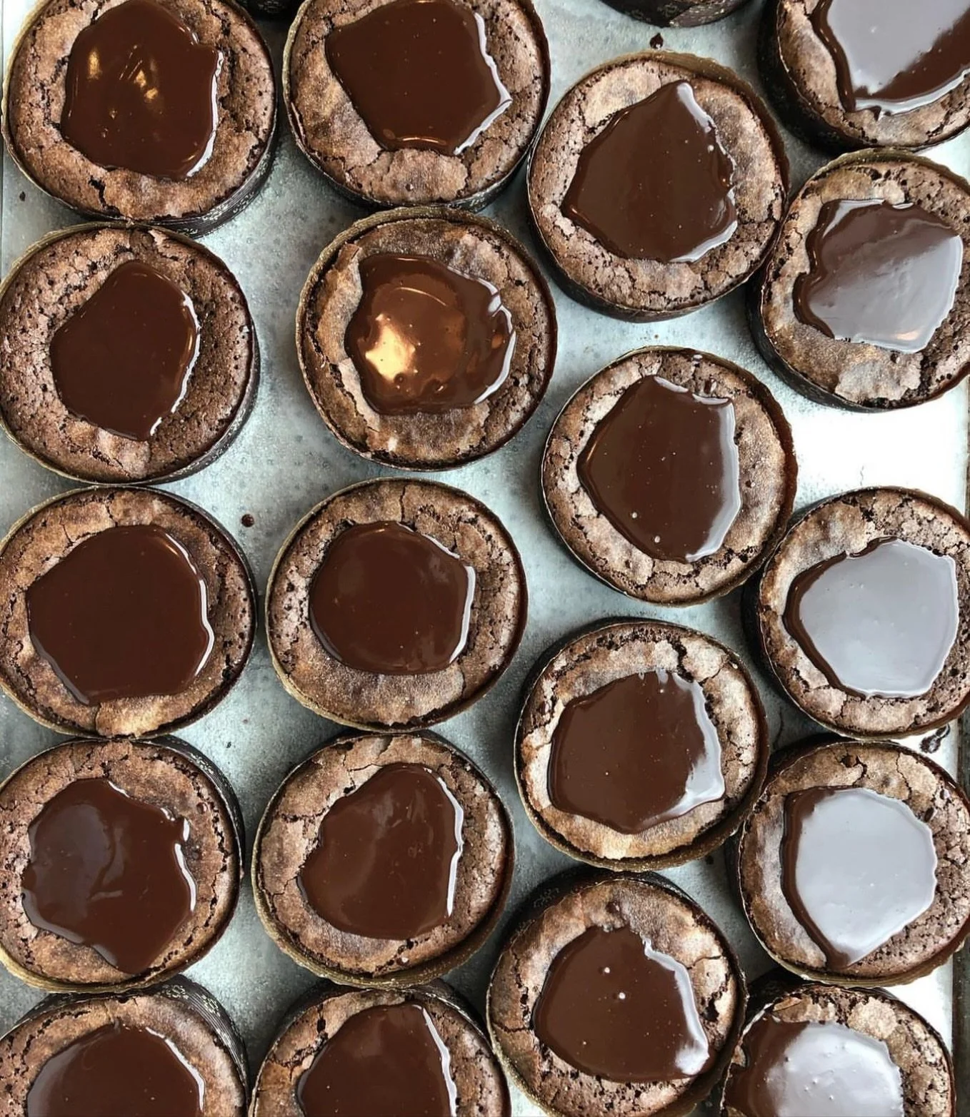 FROM OUR BAKERY
Flourless Chocolate Cakes with chocolate ganache puddles.  Callebaut 54.5% chocolate, Valrhona cocoa powder, butter, eggs, cream, vanilla bean, sugar. $6.99

#bakery #chocolatecake #market #portlandmaine
@callebautchocolate @valrhonau