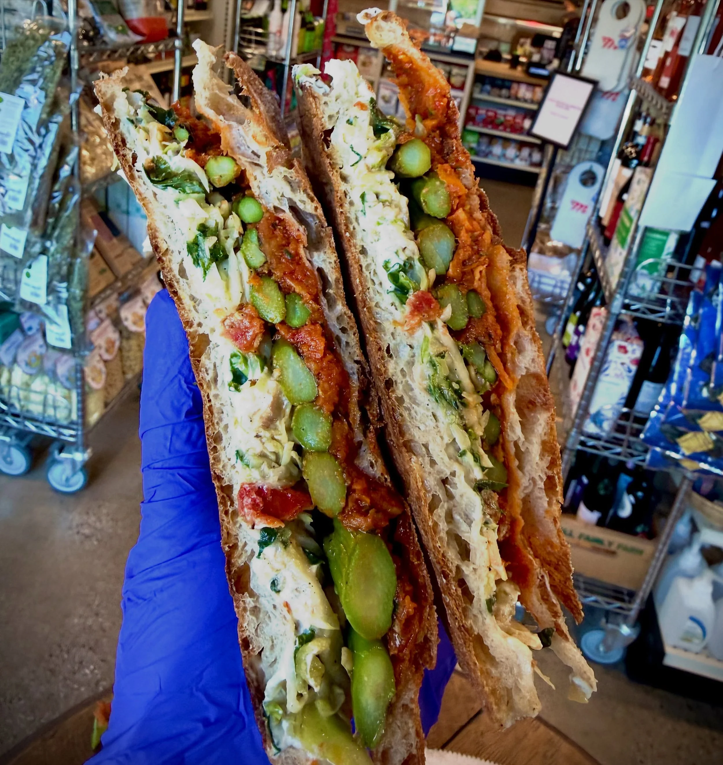 GRILLED ASPARAGUS SANDWICH 
With our house-made creamy vegan &lsquo;goat&rsquo; cheese, salsa rossa, and hazelnut slaw on our bakery&rsquo;s pizza bianca flatbread.  Crisp, savory, plant-based delicious! 🌱❤️

HAPPY TUESDAY! 
#sandwiches #pizza #sala