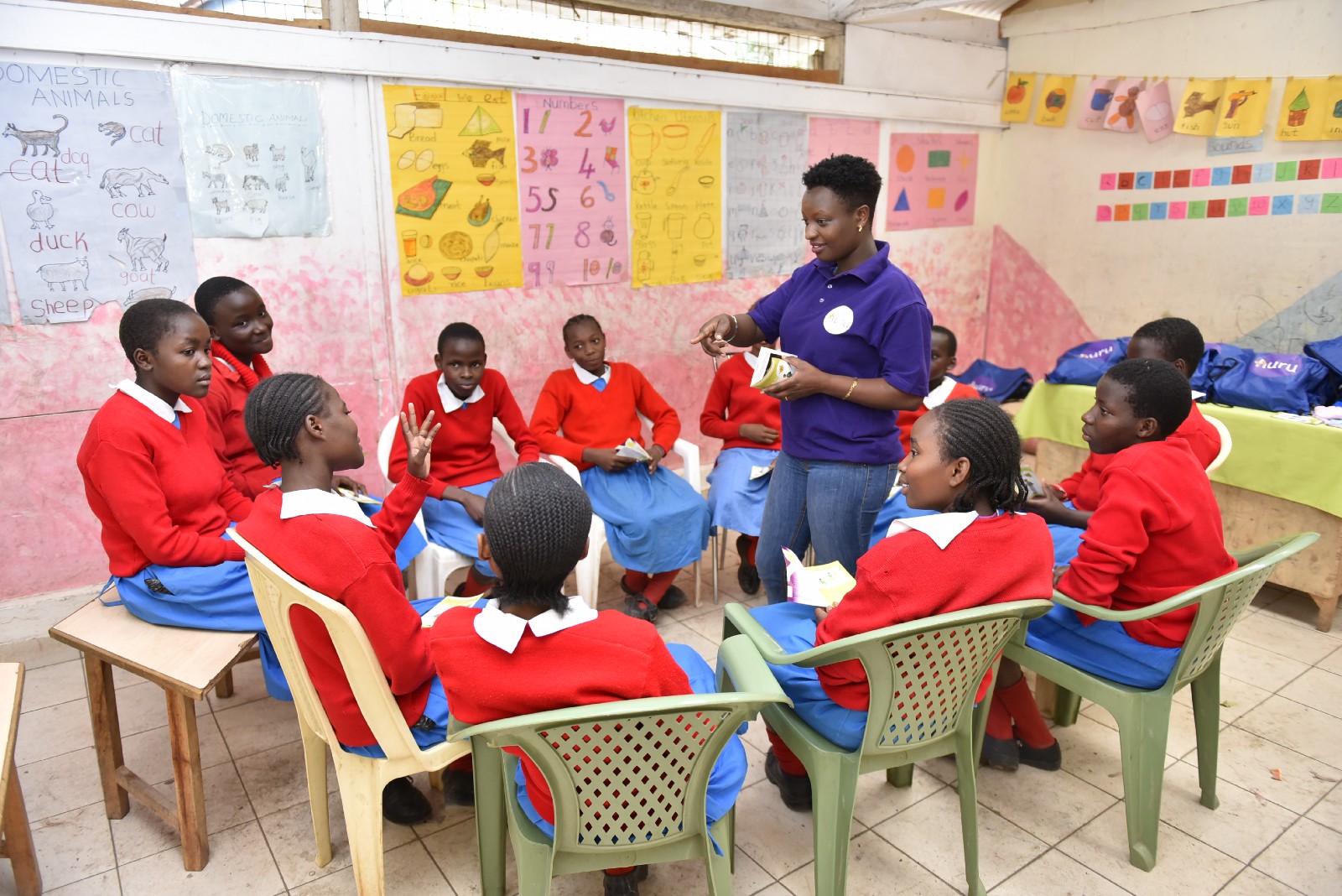 A Huru Youth Facilitator leads a small-group breakout session
