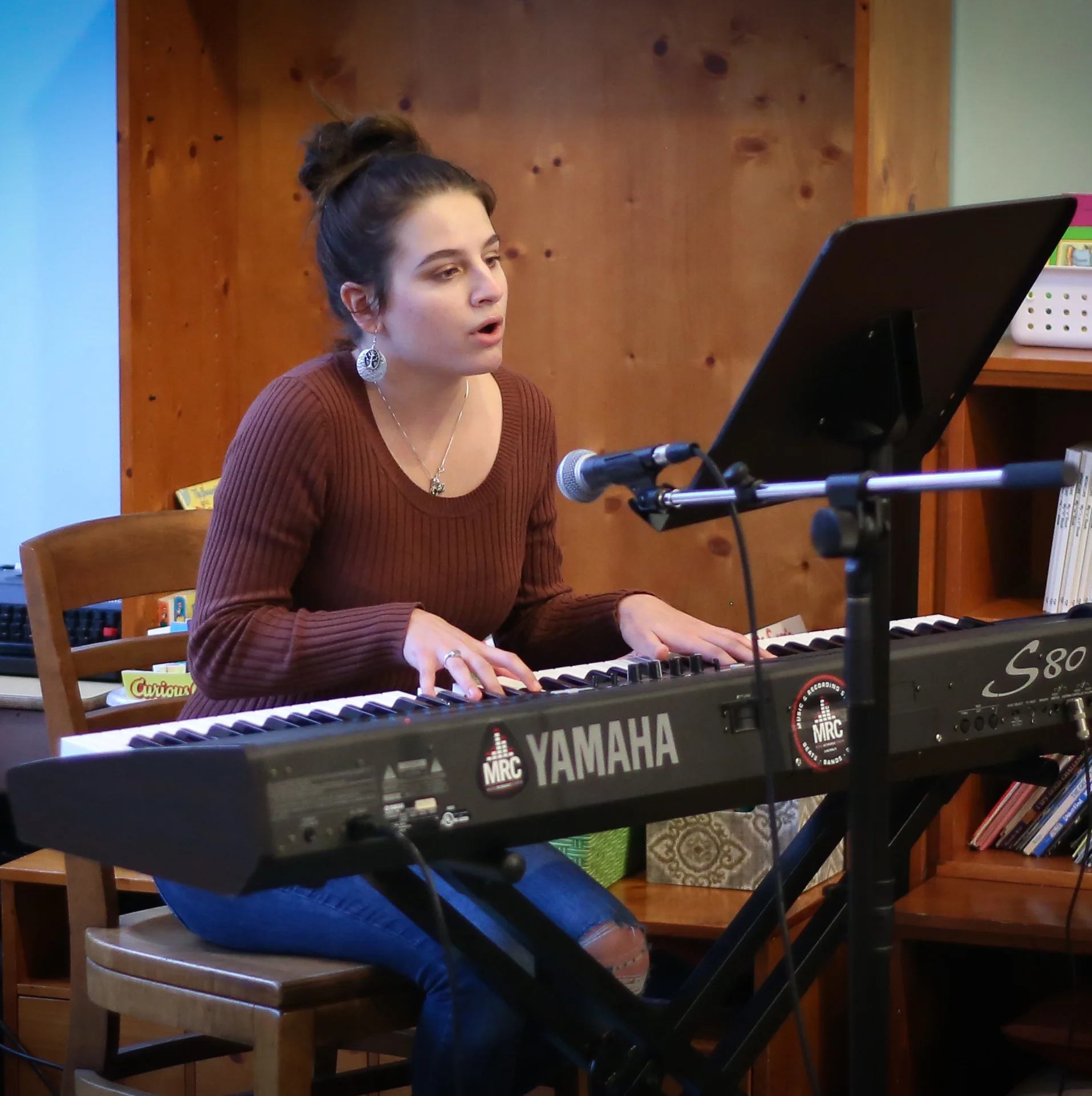 Grace from Music Resource Center performing an original piece.