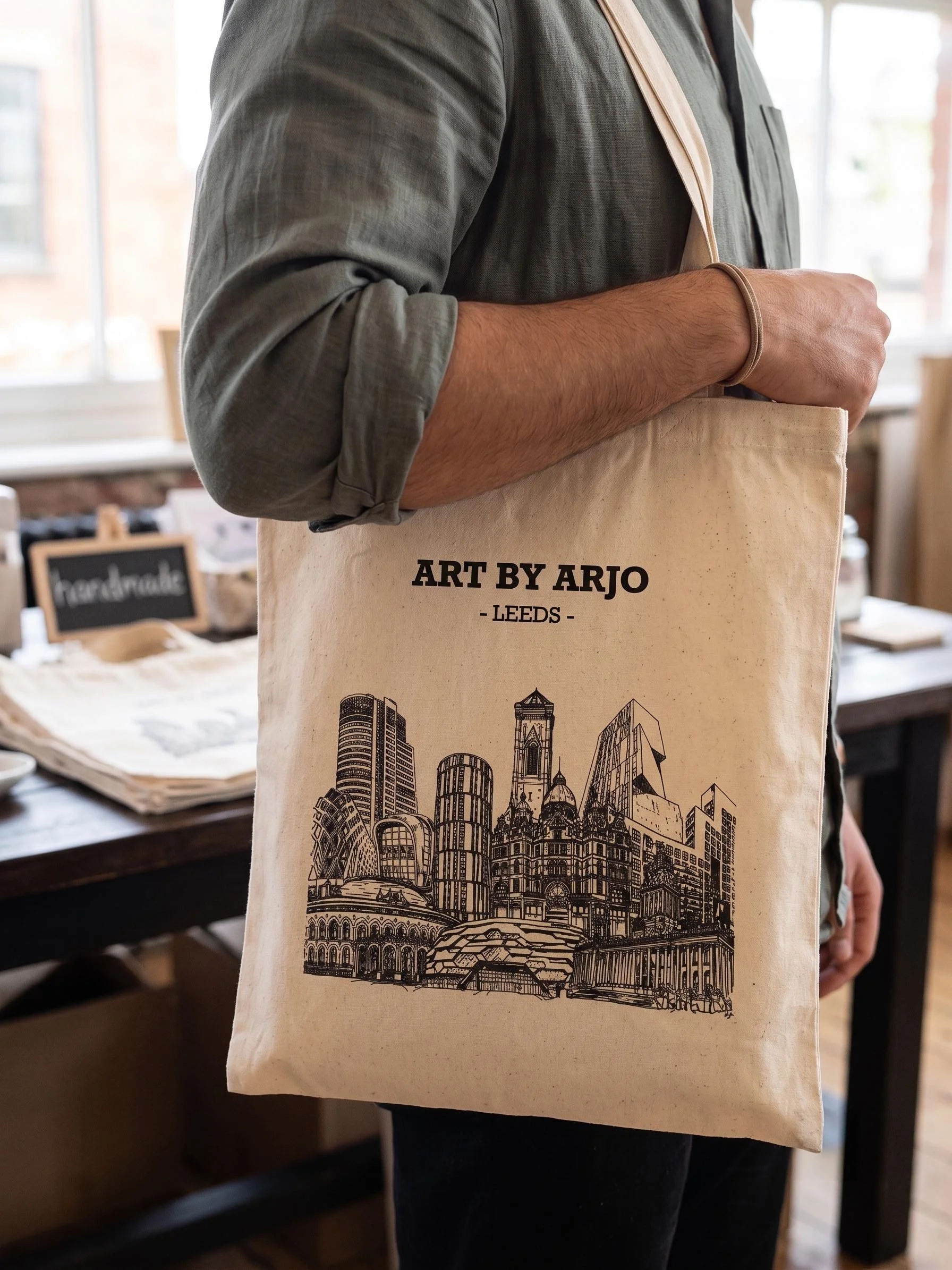 Tote bag leeds design being held 2.jpg