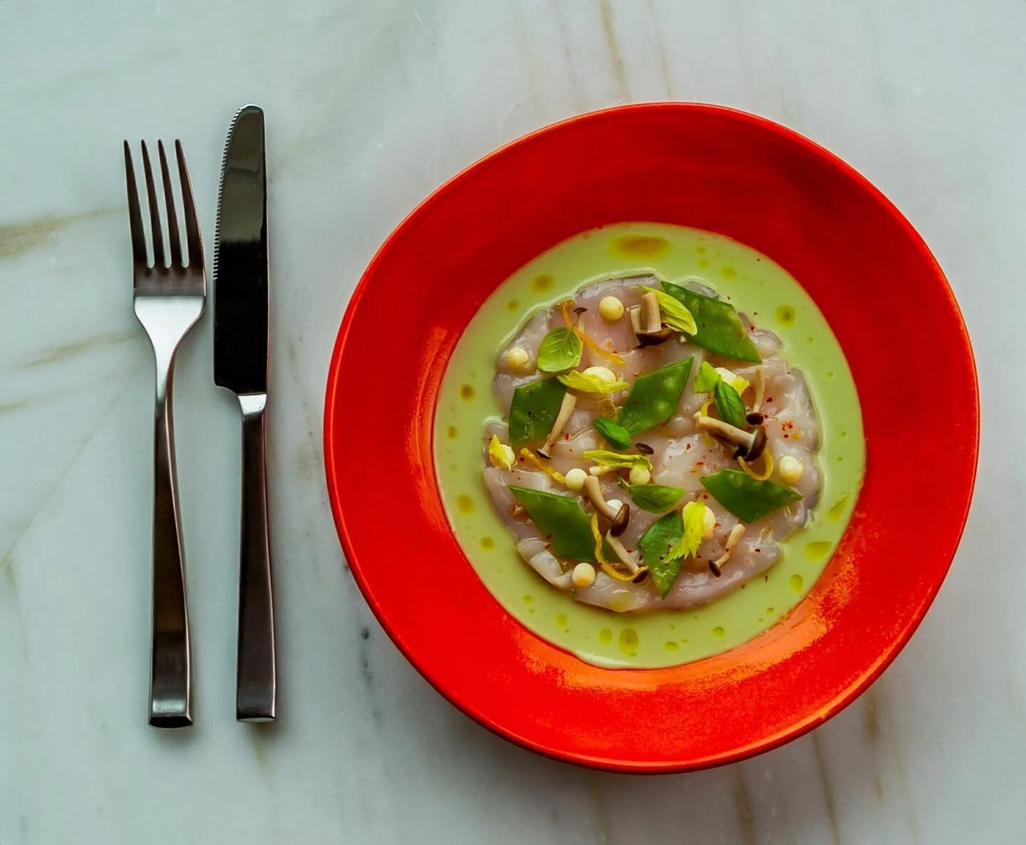 Scallop crudo | Cucumber gazpacho, pickled mushrooms and sugar snap peas, preserved lemon, micro herbs

Chef @sierra4407 
I used the natural light coming through the window from the top of the frame and a soft box with 1200w to fill in any shadow fro