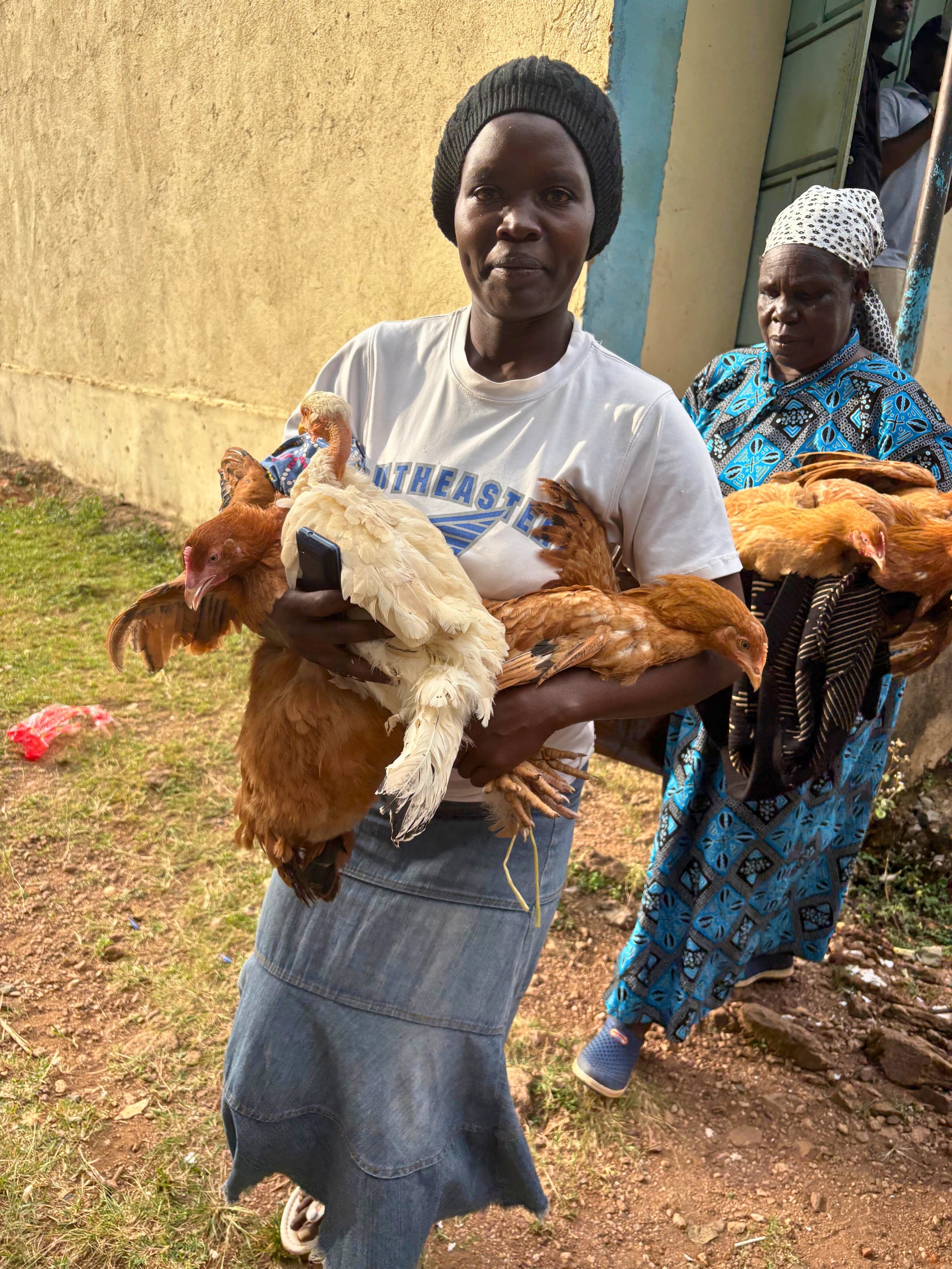 Two widows gifted three hens for poultry business