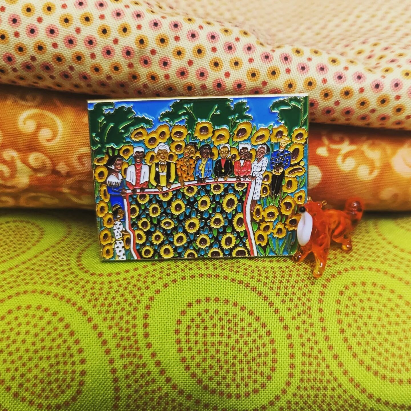 This enamel pin is a replica of the exquisite lithograph &quot;The Sunflower Quilting Bee at Arles&quot; by Faith Ringgold (1996).

The original lithograph resides at The Philadelphia Art Museum (@philamuseum ), although it is currently not on displa