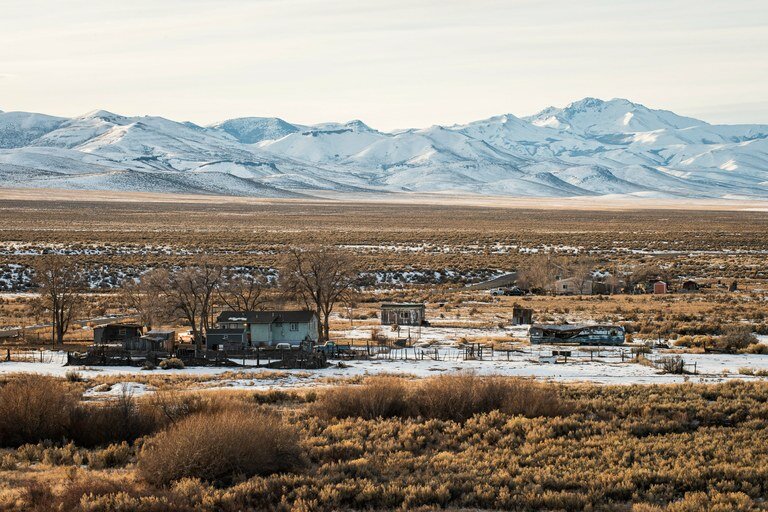 Homes on the Fort McDermitt Paiute and Shoshone Tribe’s reservation sit on the Quinn River Valley floor as the Santa Rosa Mountains rise in the background.Russel Albert Daniels / High Country News