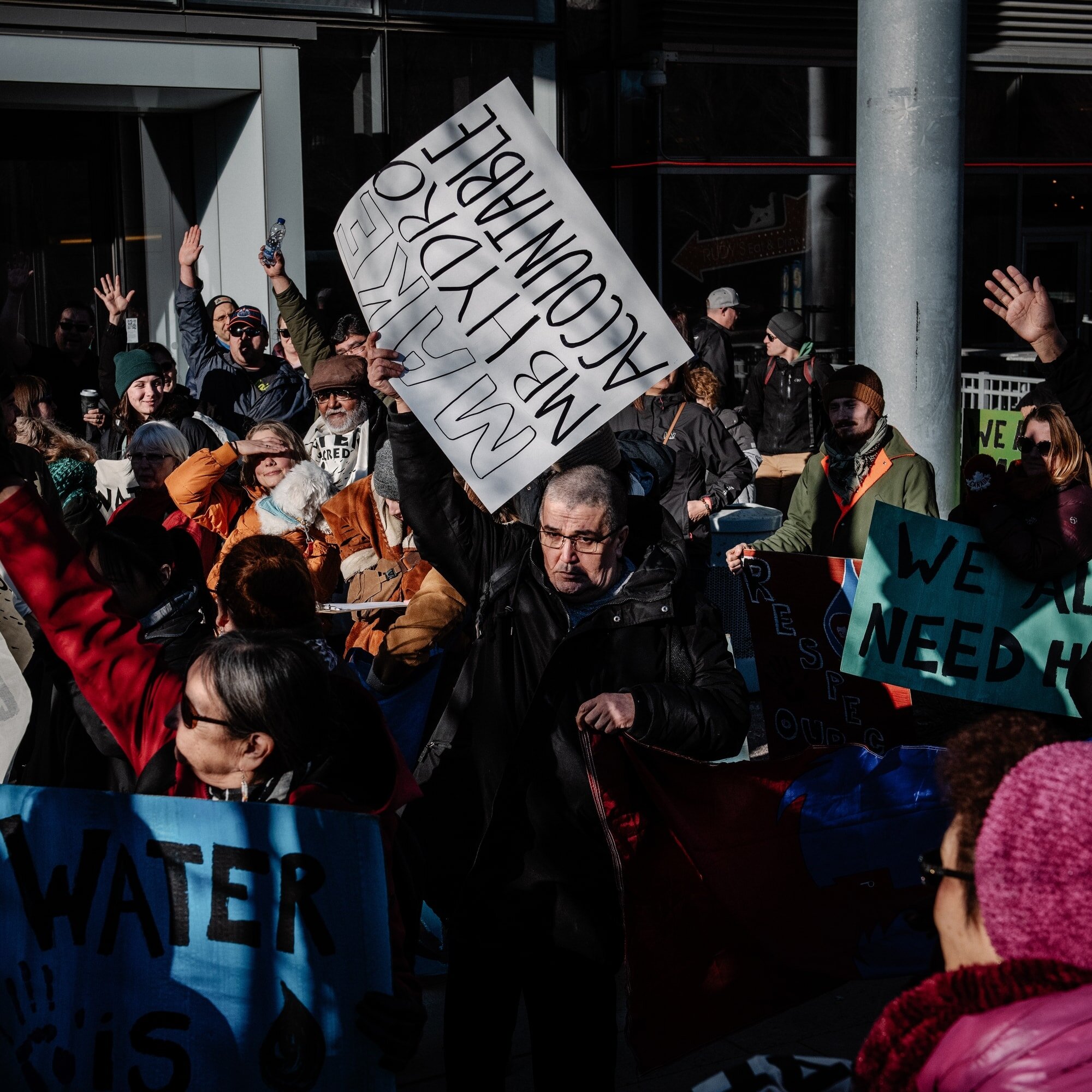 Protesters march outside the headquarters of Manitoba Hydro in Winnipeg during World Water Day on March 22, 2019.