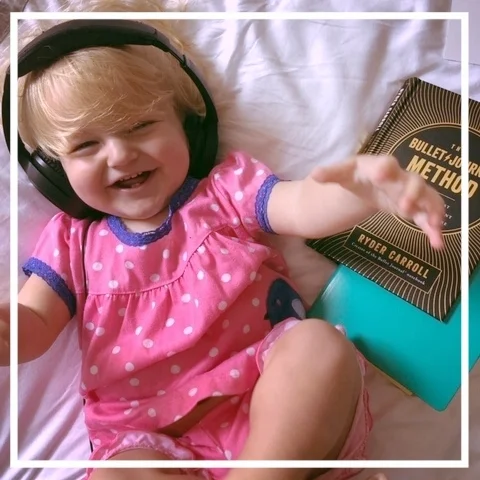 I’ve started a Bullet Journal page for capturing baby Eliza’s milestones. She LOVES wearing my podcast headphones.