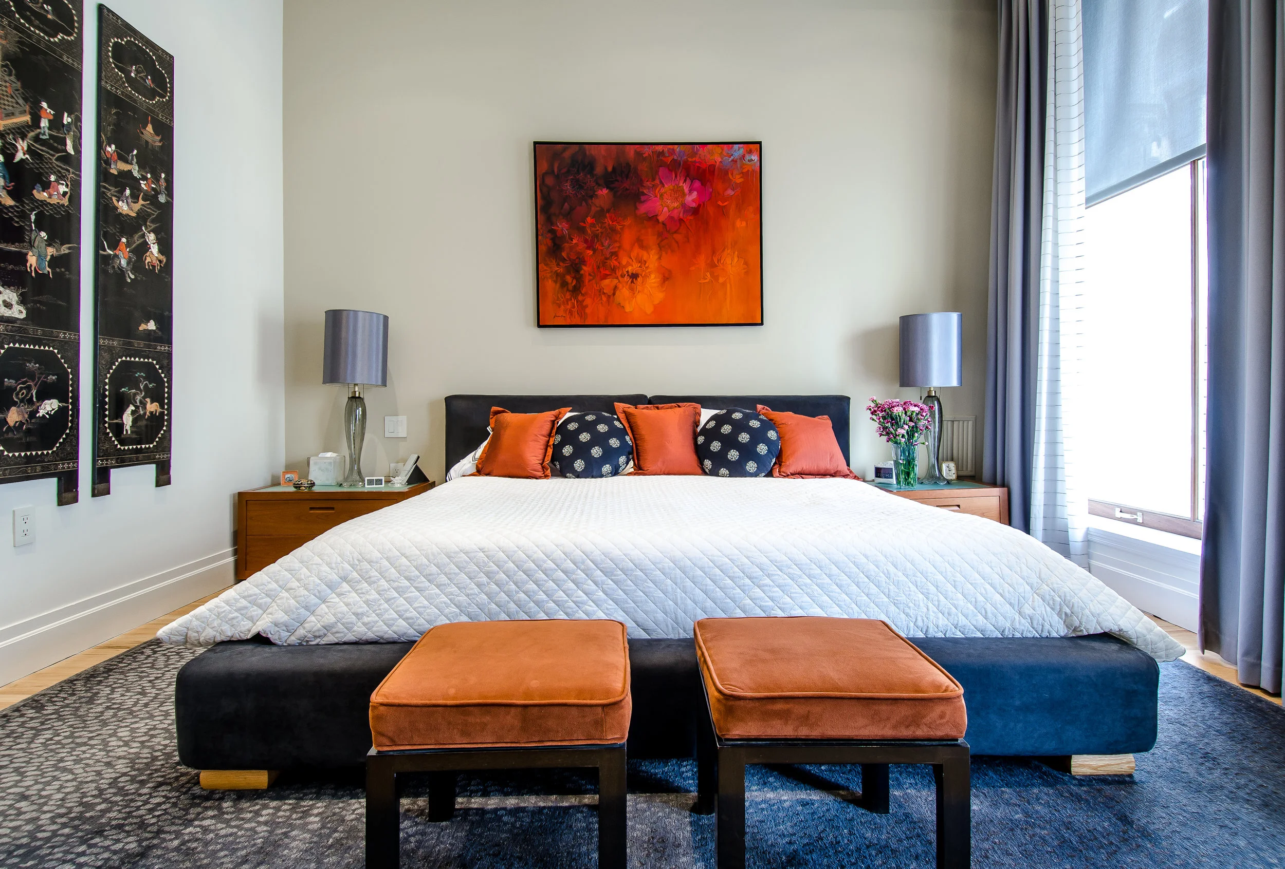 Large bedroom with pops of red interior