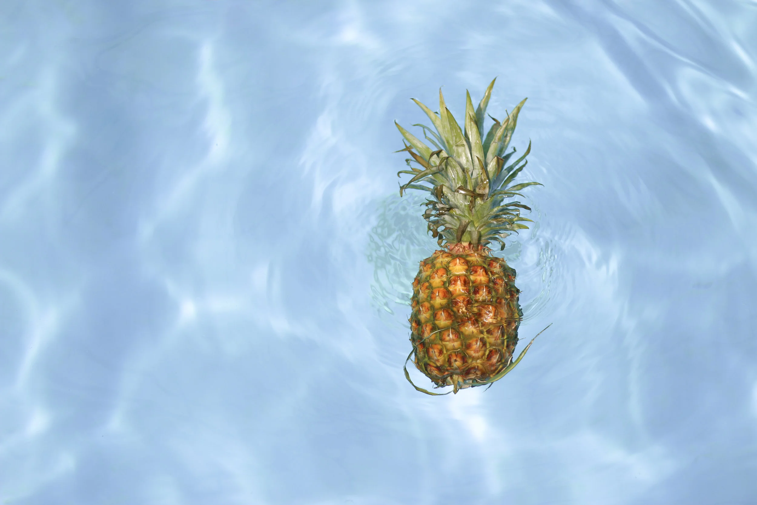 Floating pineapple. Symbol of welcoming.