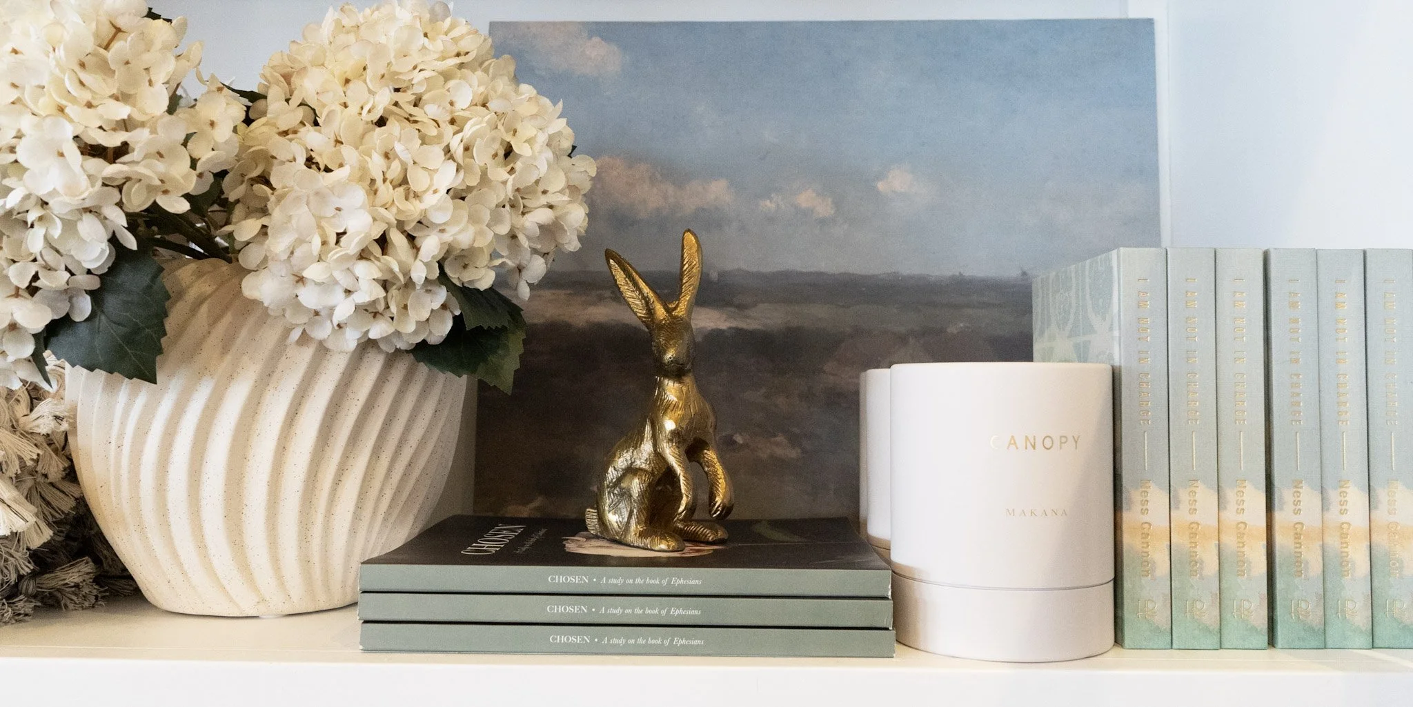 Little Brass Rabbit with Books Spring 2025.jpg
