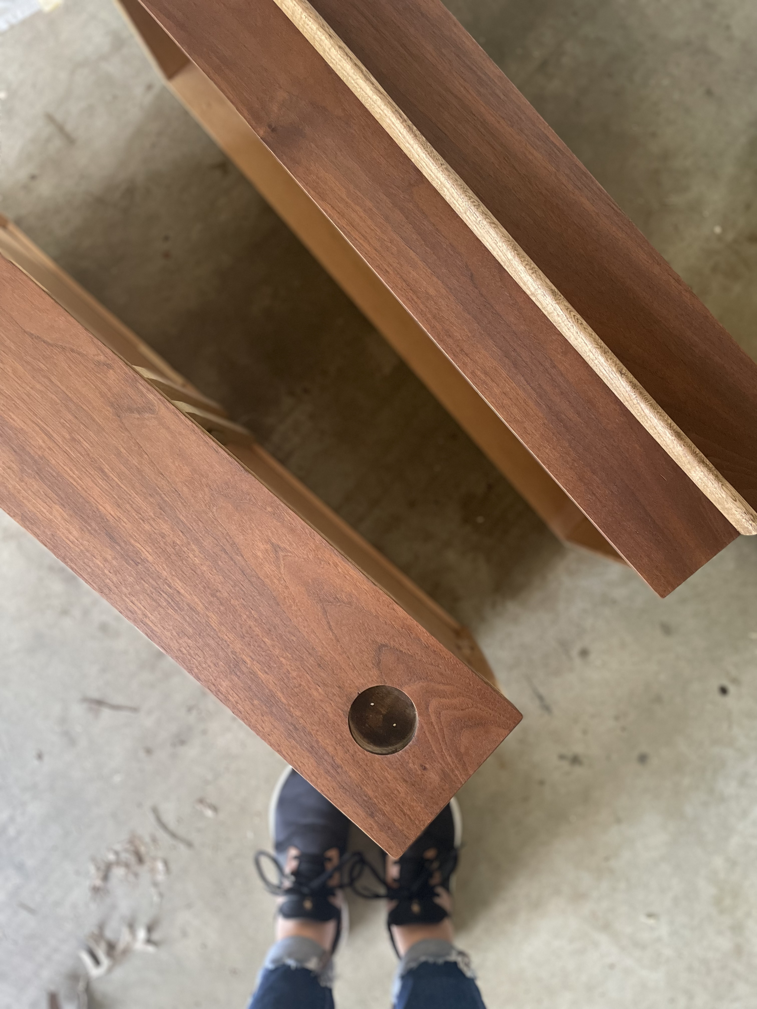 Stained Mid Century Bassett Dresser Drawers when refinishing this furniture piece with a cherrywood gel stain. The drawers have a circular drawer pull on them.