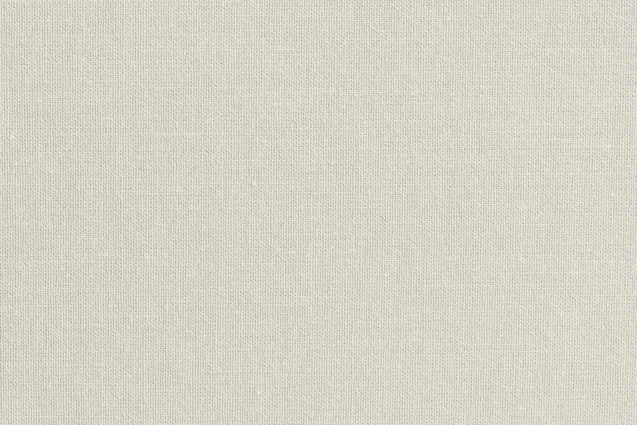 A plain beige textured wall.