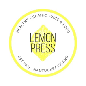 Circular logo with a yellow border. Inside the circle, it reads 'Healthy Organic Juice & Food' at the top and 'EST 2015, Nantucket Island' at the bottom. In the center, there is a yellow lemon shape with the words 'Lemon Press' written across it.