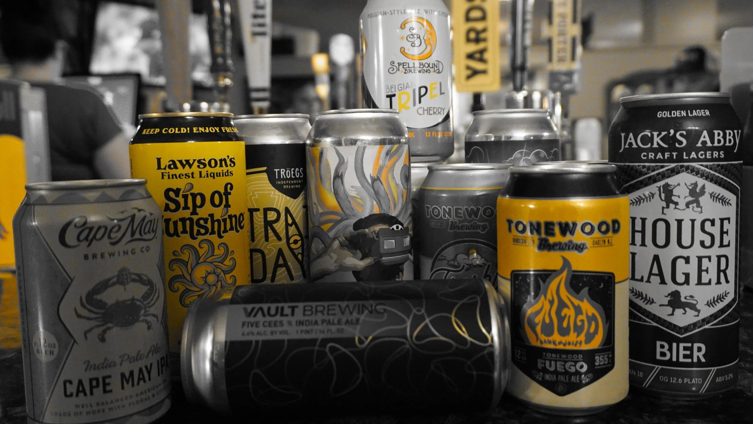 Assortment of colorful craft beer cans on display at John & Molly's Tavern in Eastampton, NJ – featuring a great selection of local and rotating NJ brews, available for dine-in or to-go!
