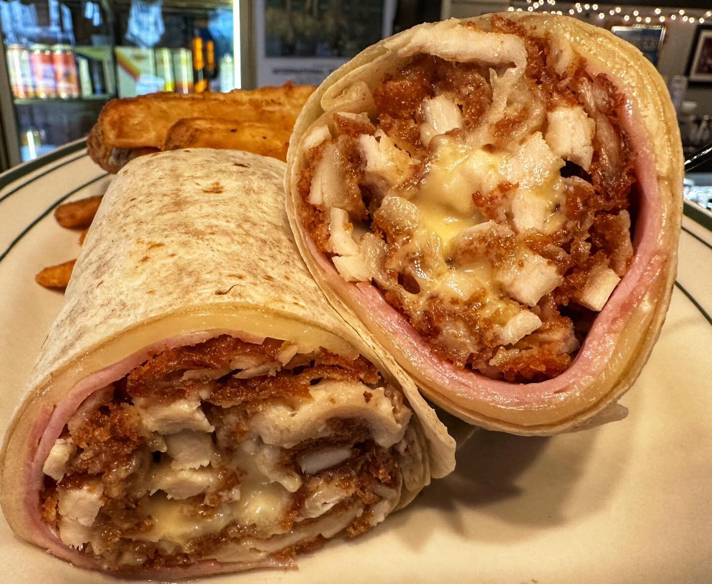 Chicken Cordon Bleu Wrap!

A new special today that is made with our Handmade Breaded Chicken Cutlet, Ham, Swiss Cheese, &amp; Honey Mustard in our Flour Tortilla Wrap!

Come on in and check it out!