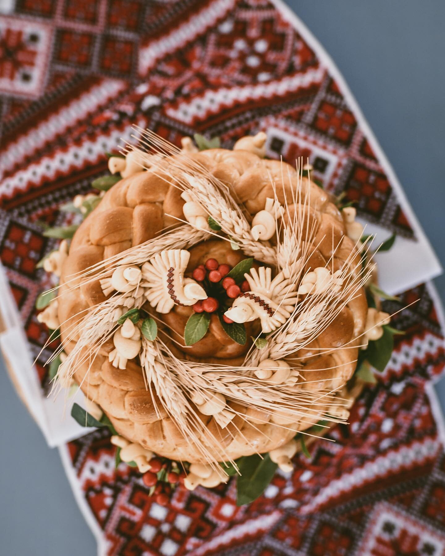 As my first official Lilias &amp; Olive wedding, I had the special opportunity to include many Ukrainian wedding traditions to honor the bride and her family.  Seen here is The Korovai - a beautiful bread that is a work of art offered as a blessing f