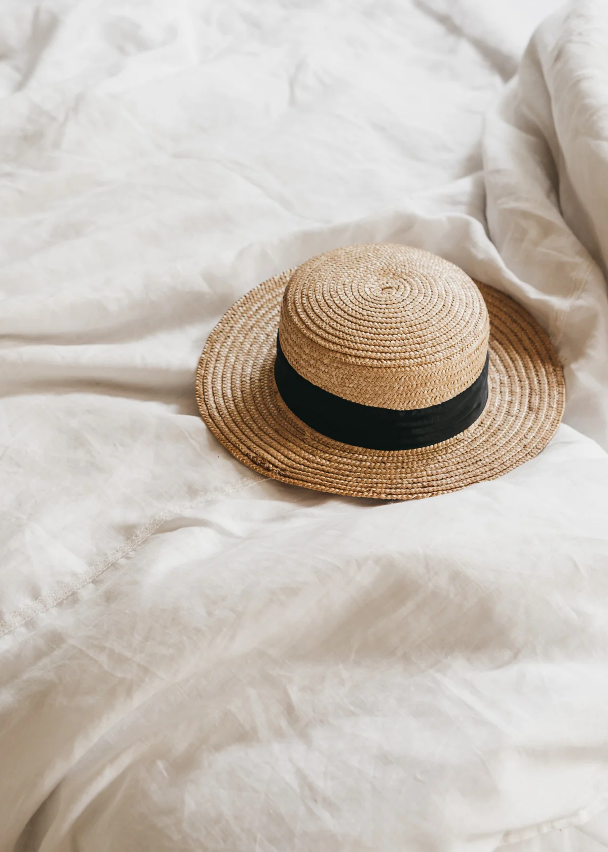 Keira-Mason-in-between-the-sheets-straw-hat-bed.jpg