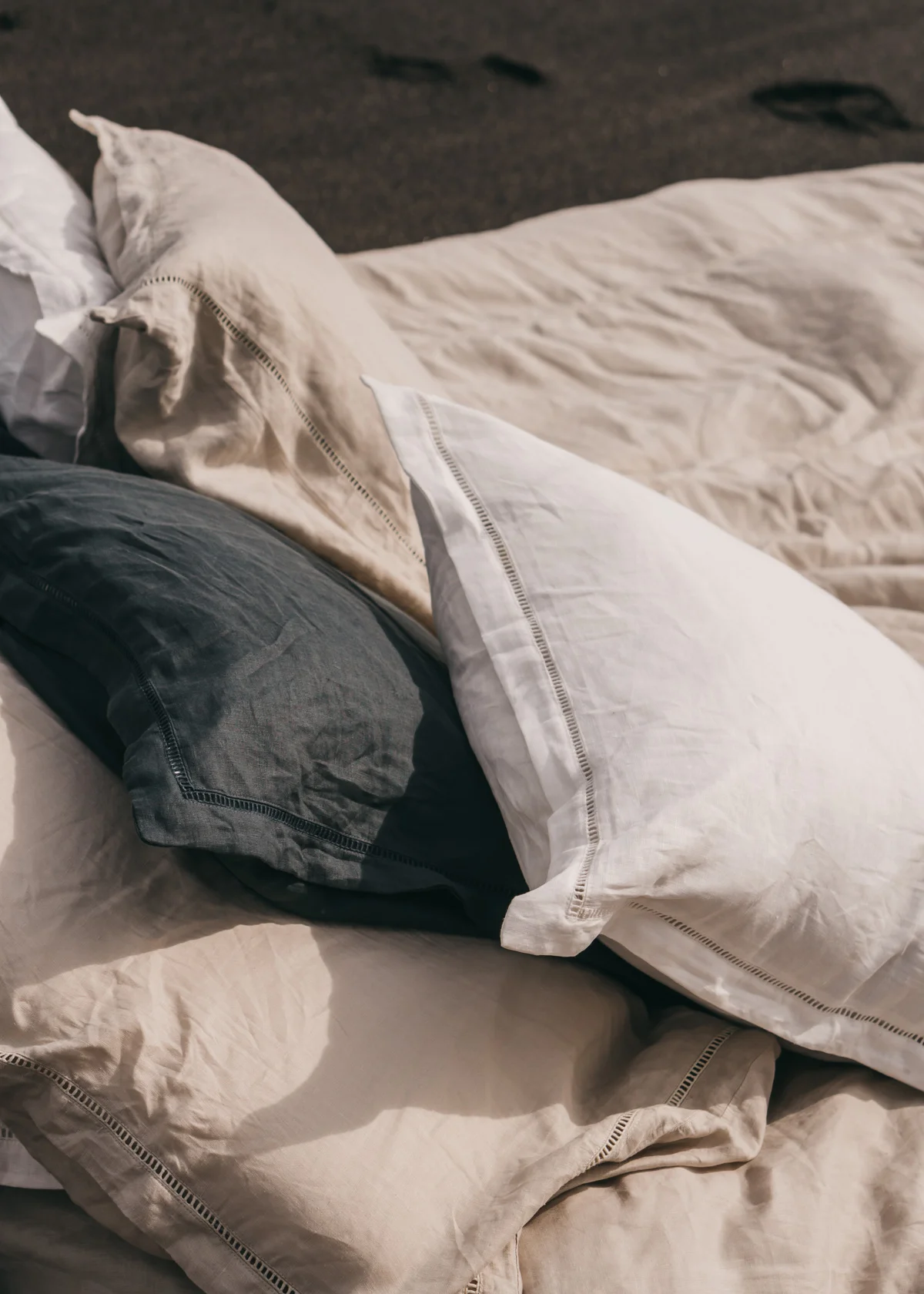 Keira-Mason-in-between-the-sheets-cream-white-navy-pillows.jpg