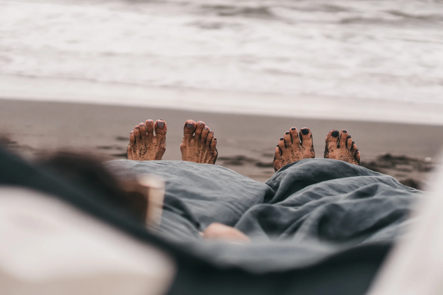 Keira-Mason-in-between-the-sheets-toes-out-of-bed.jpg