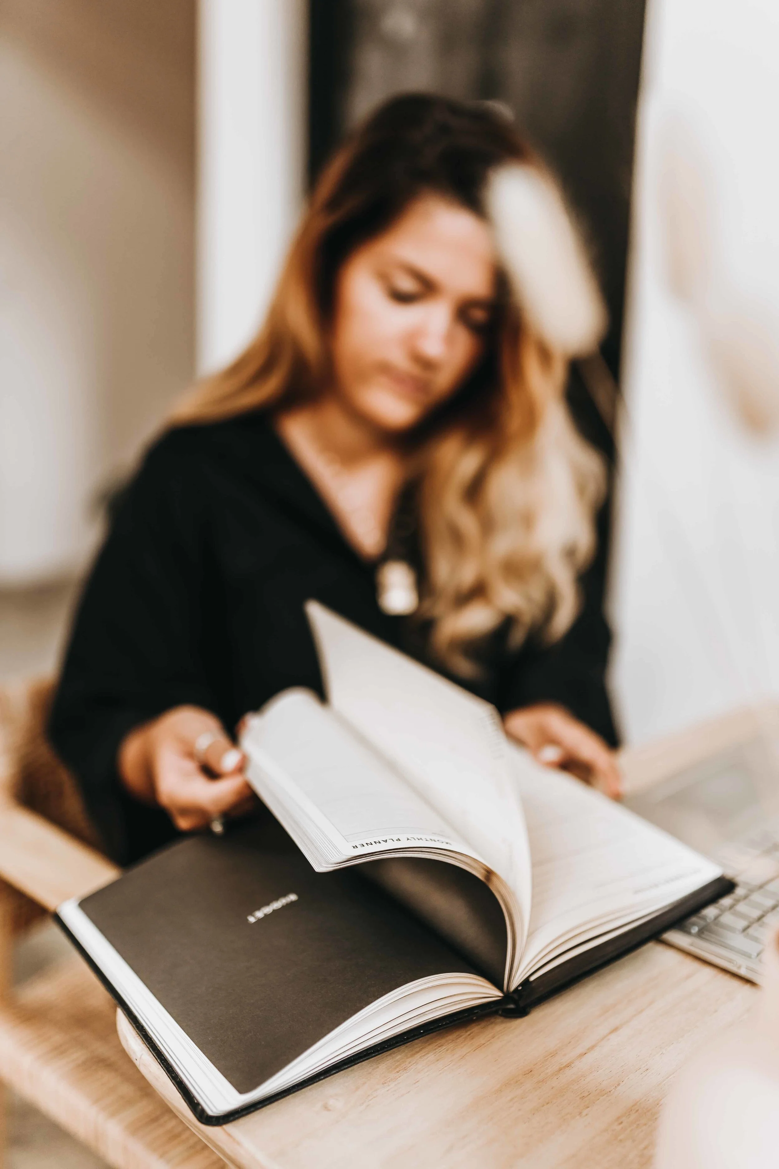 keira-mason-zest-bookkeeping-solutions-filpping-through-diary-pages.jpg