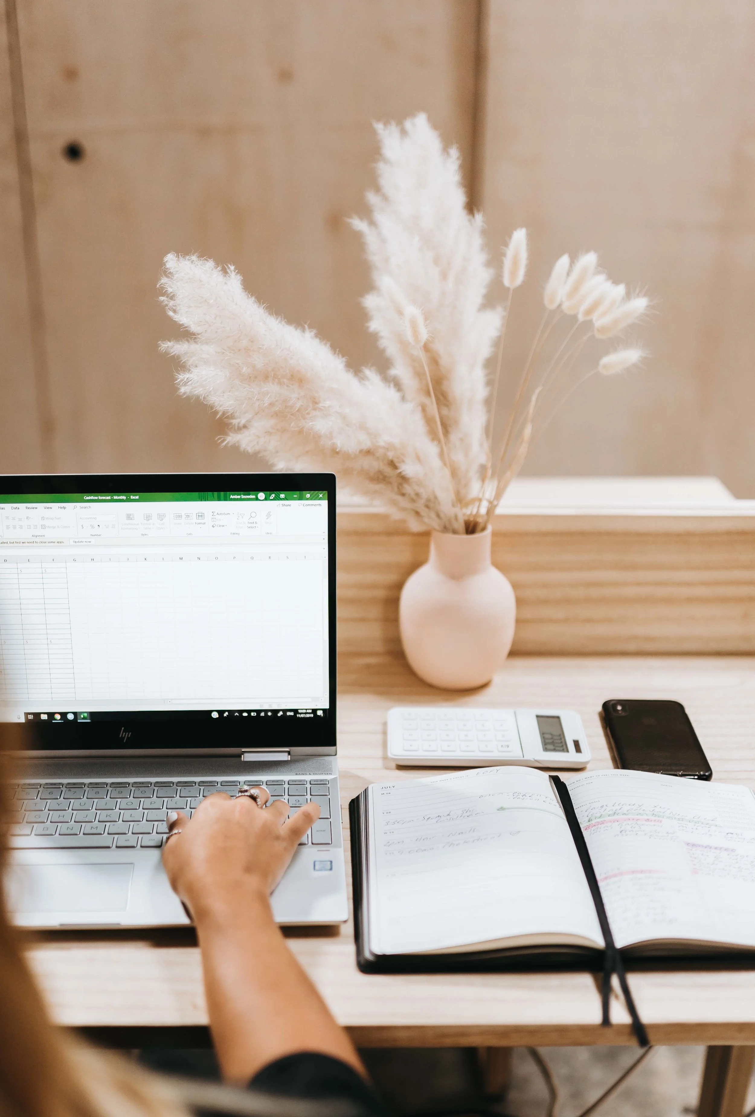 keira-mason-zest-bookkeeping-solutions-working-on-spreadsheet.jpg