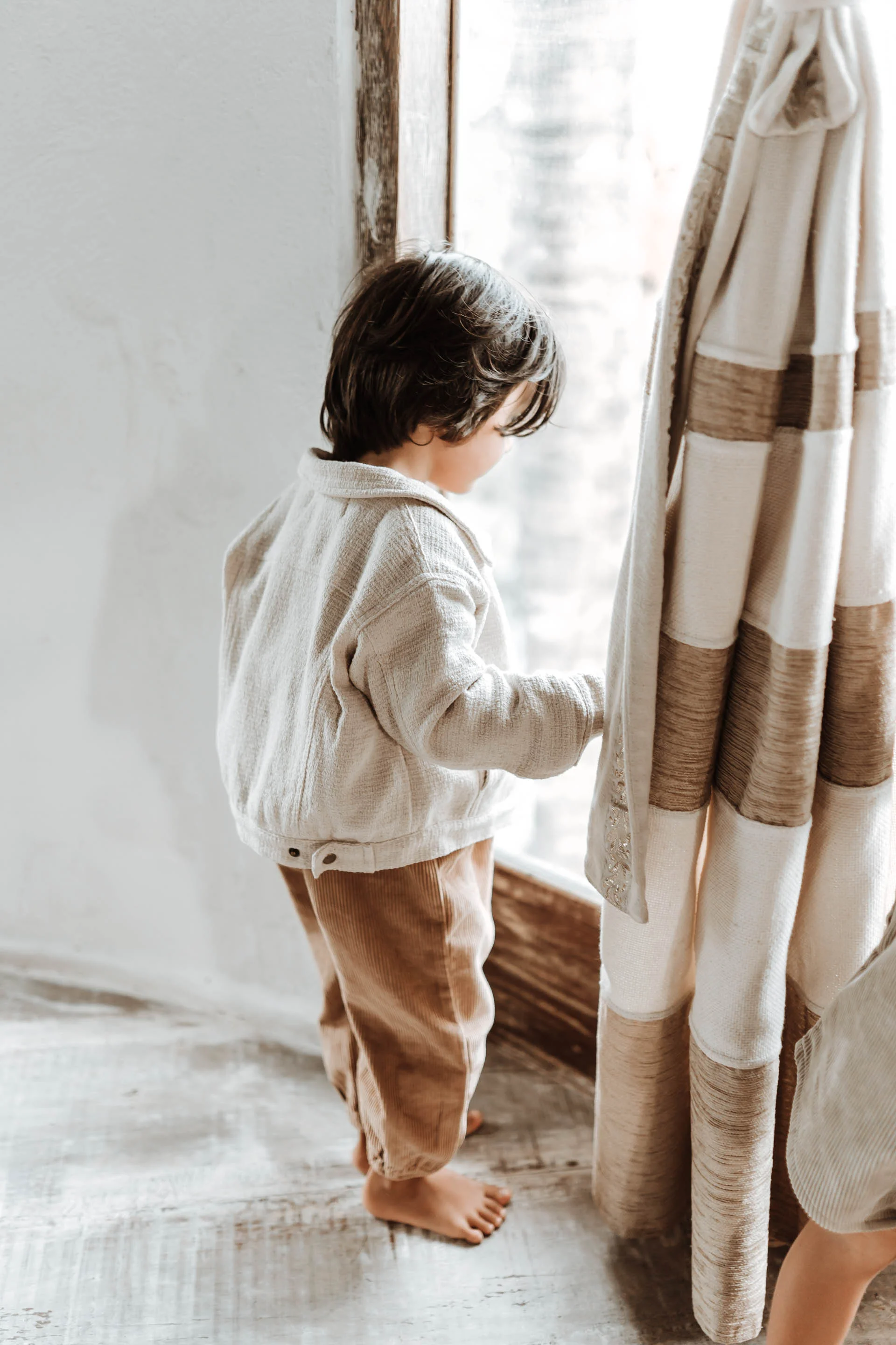 keira-mason-illoura-the-label-boy-looking-out-window.jpg