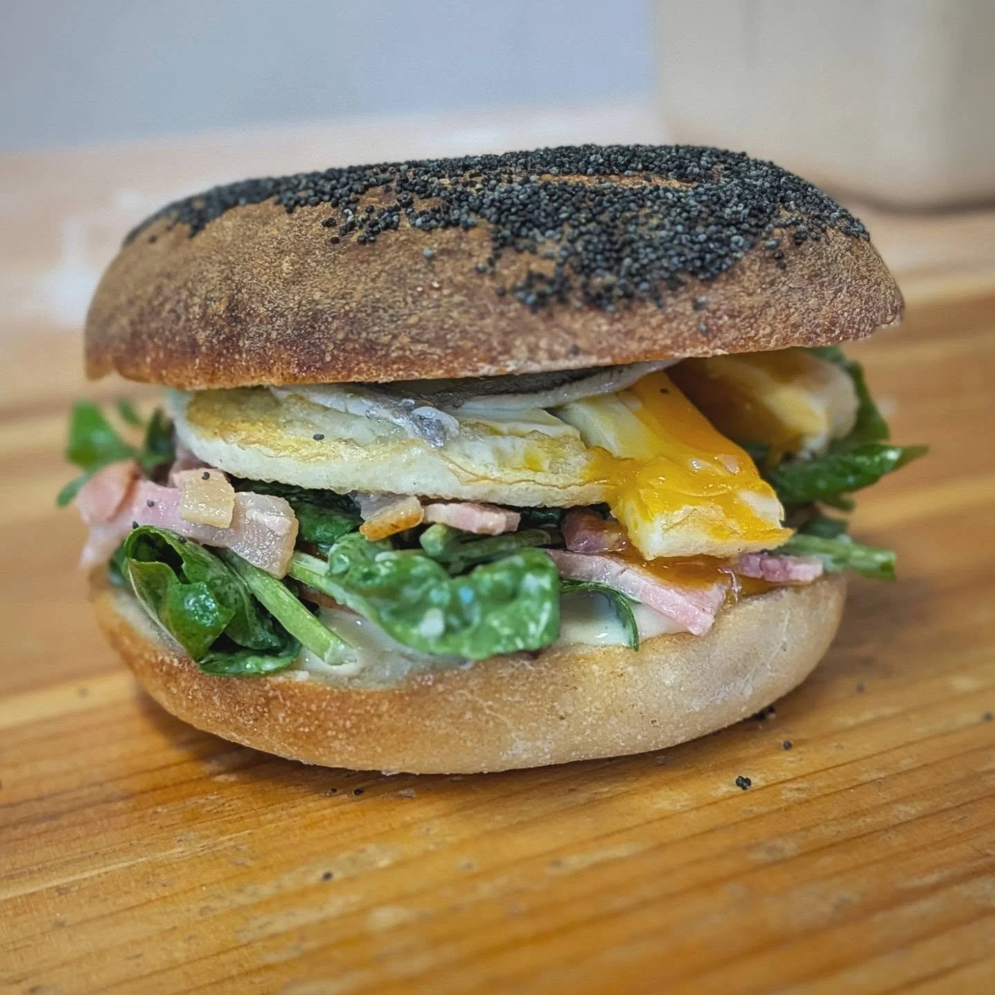 Look out for the Caesar bagel in our sandwich fridge. 
Guzzy egg, white anchovy, bacon, all the good stuff