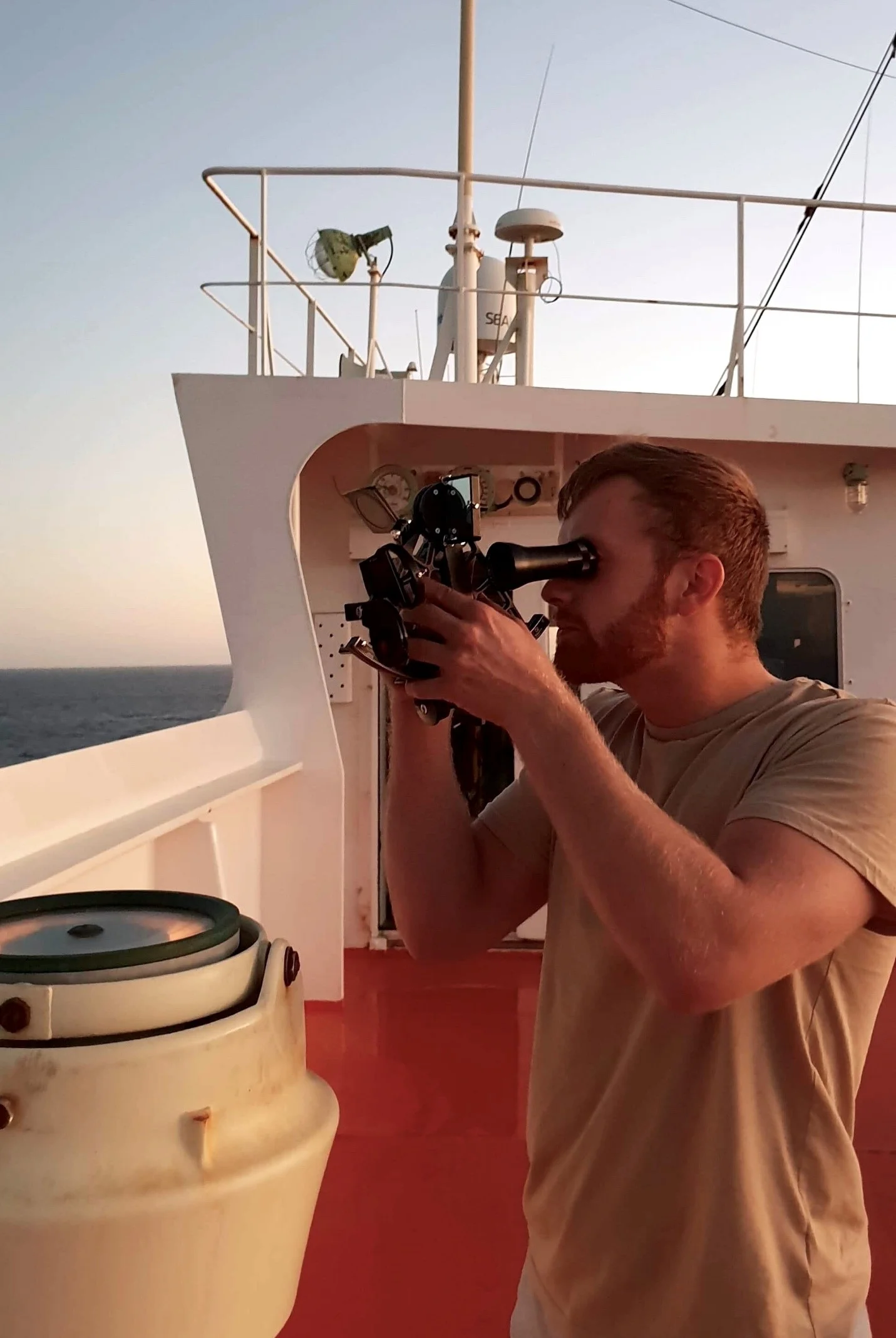 Image: Henrik Reiten on board the MV Banastar, operating a sextant to find the position of the vessel