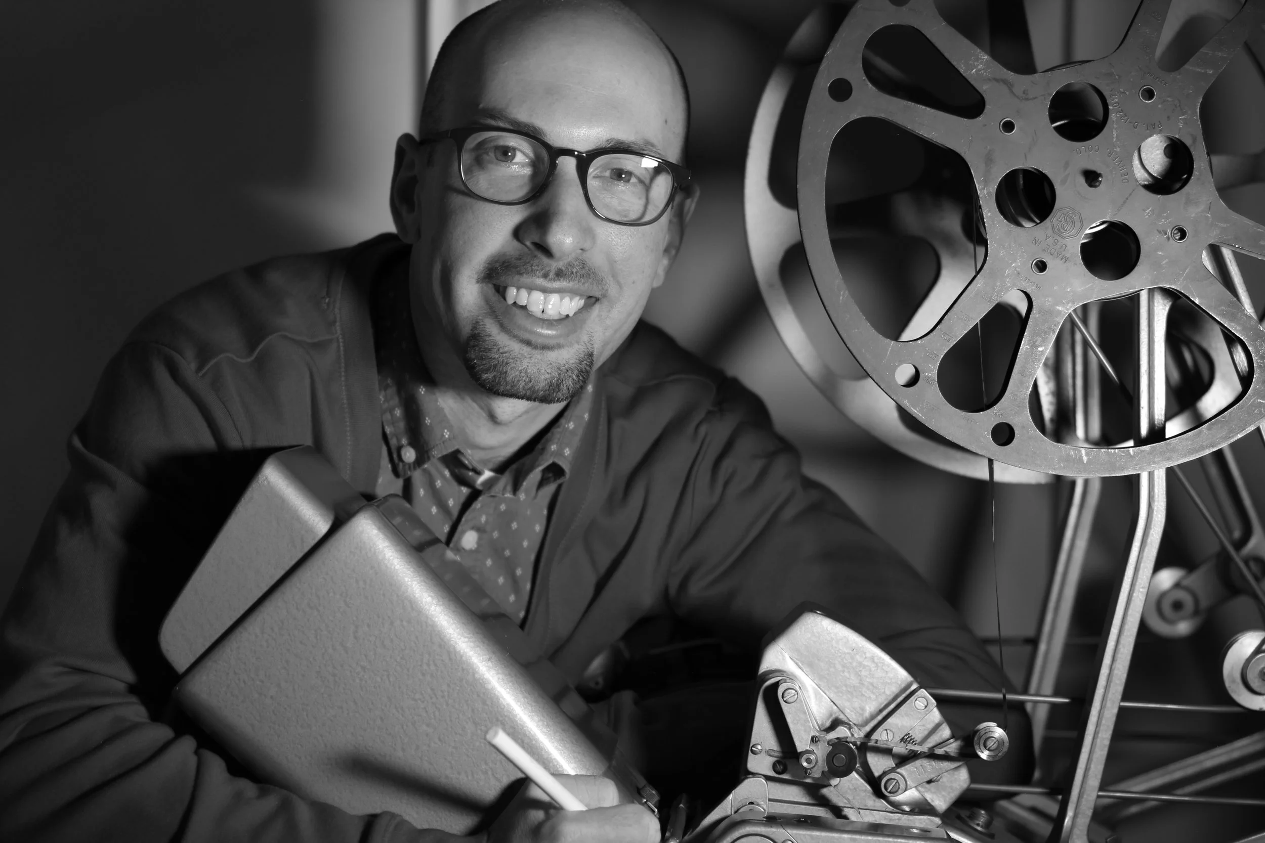 Jacob A. Dodd beside a 16mm projector