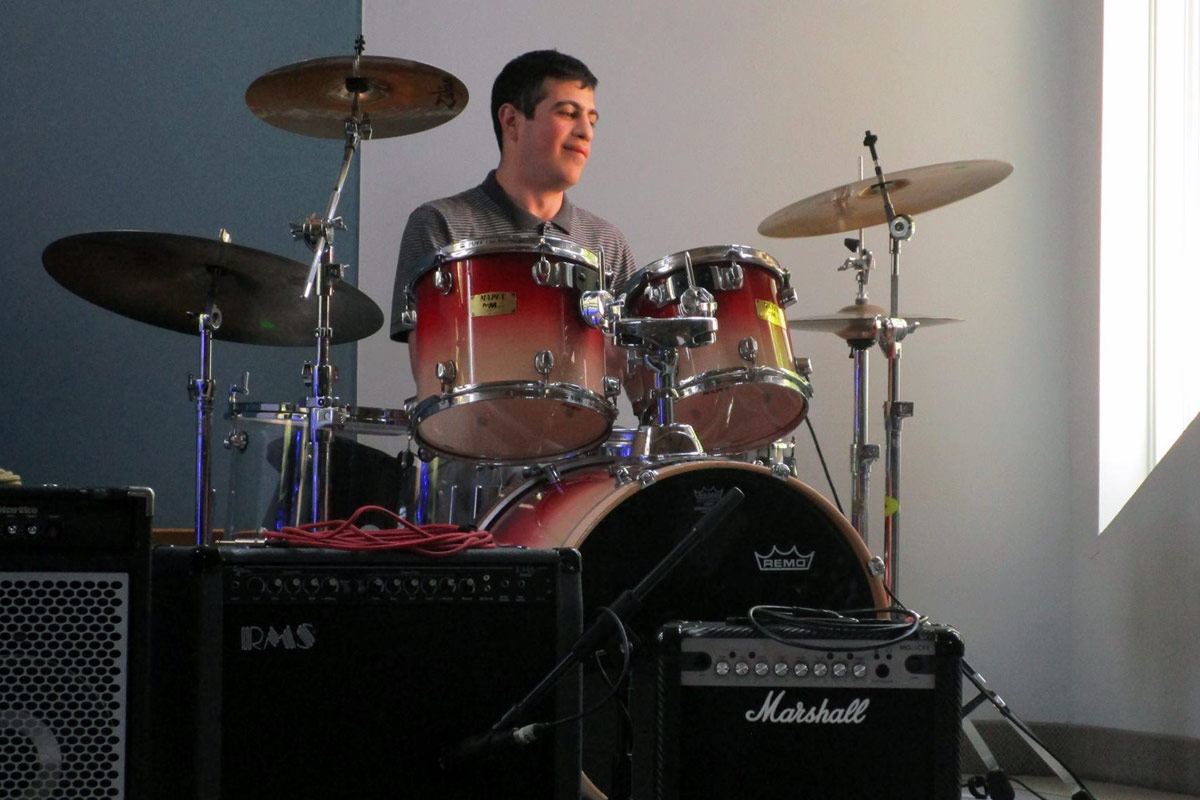 drumming lesson student performing