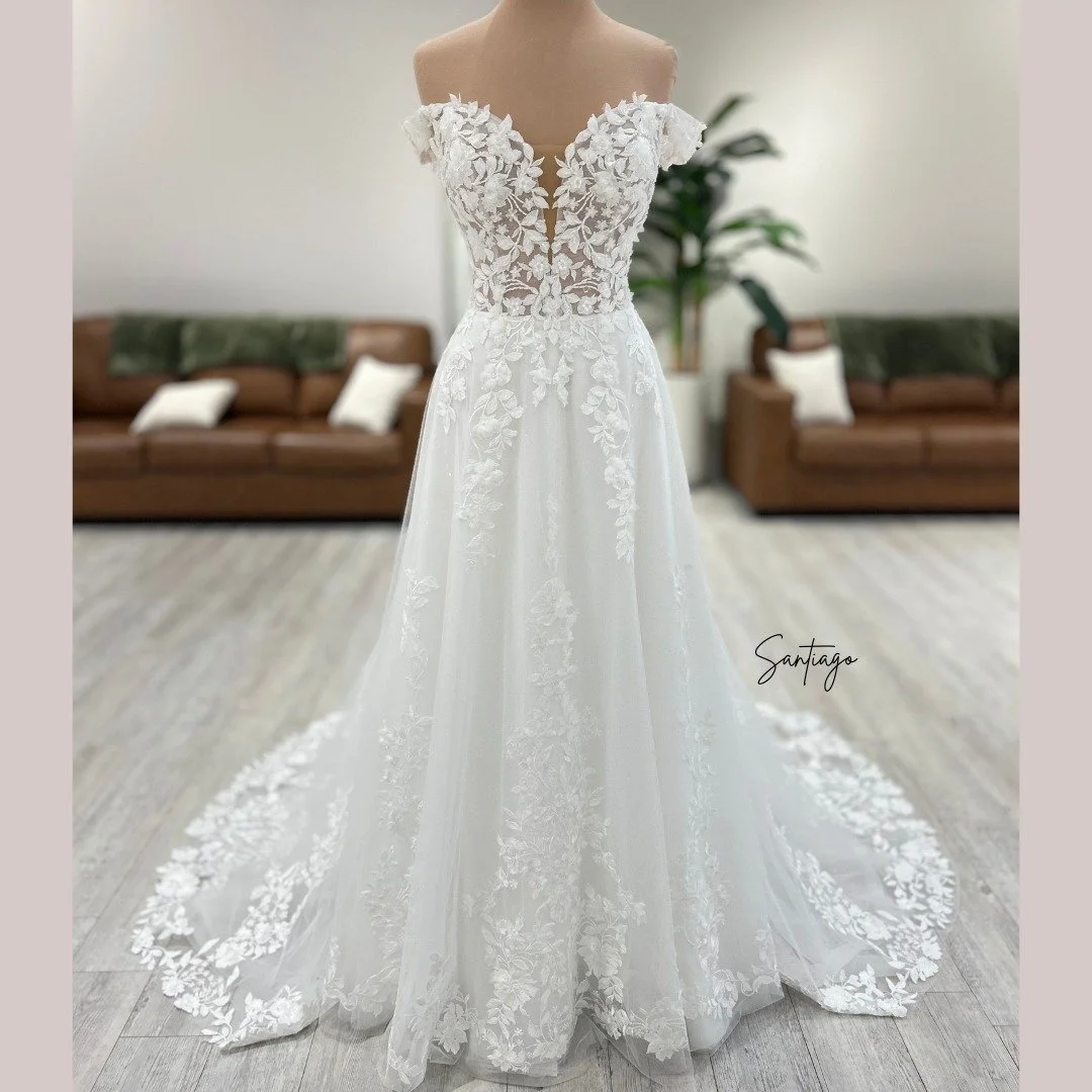 Meet Santiago - delicate leafy lace, enchanting off-the-shoulder neckline, and a dreamy flowing a-line skirt that brings all the details together. 🌿💍

Book your appointment to meet her today!

#WBridals #WeddingDress #BrideToBe #SayYesToTheDress #D