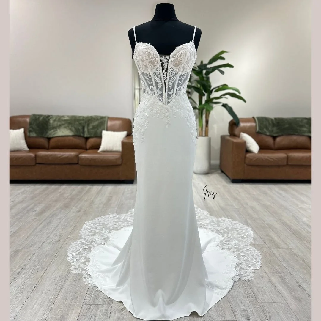 In Greek mythology Iris was the personification of the rainbow and a swift messenger of the Olympian gods. She traveled on a rainbow bridge connecting the heavens to the earth... 🌈 

Book your appointment online to meet Iris today! 

#WeddingDress #