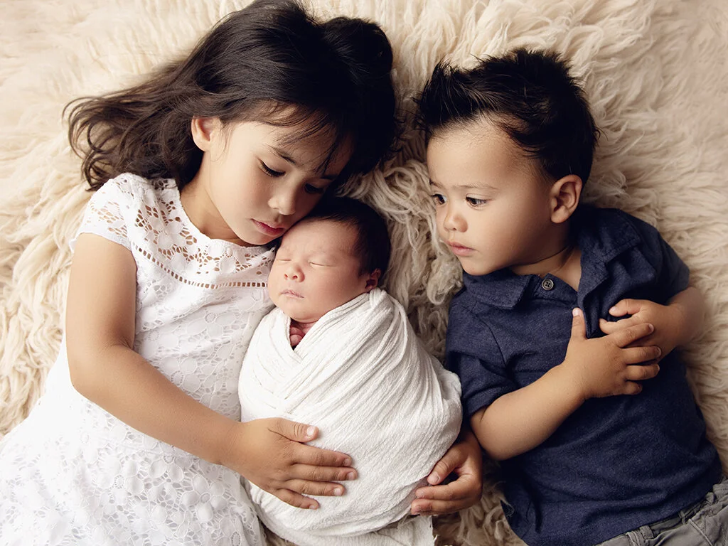 siblings and newborn sister.jpg